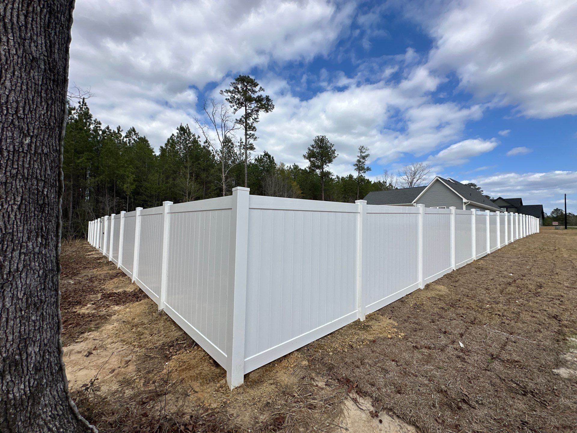 White Vinyl Privacy Fence Installation in Cameron, NC by Superior Fence and Rail