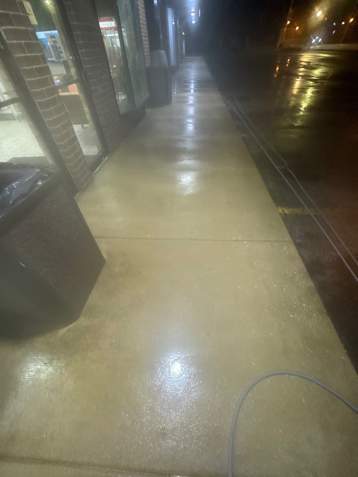 Commercial sidewalk cleaning. by Northern Power Washing LLC.