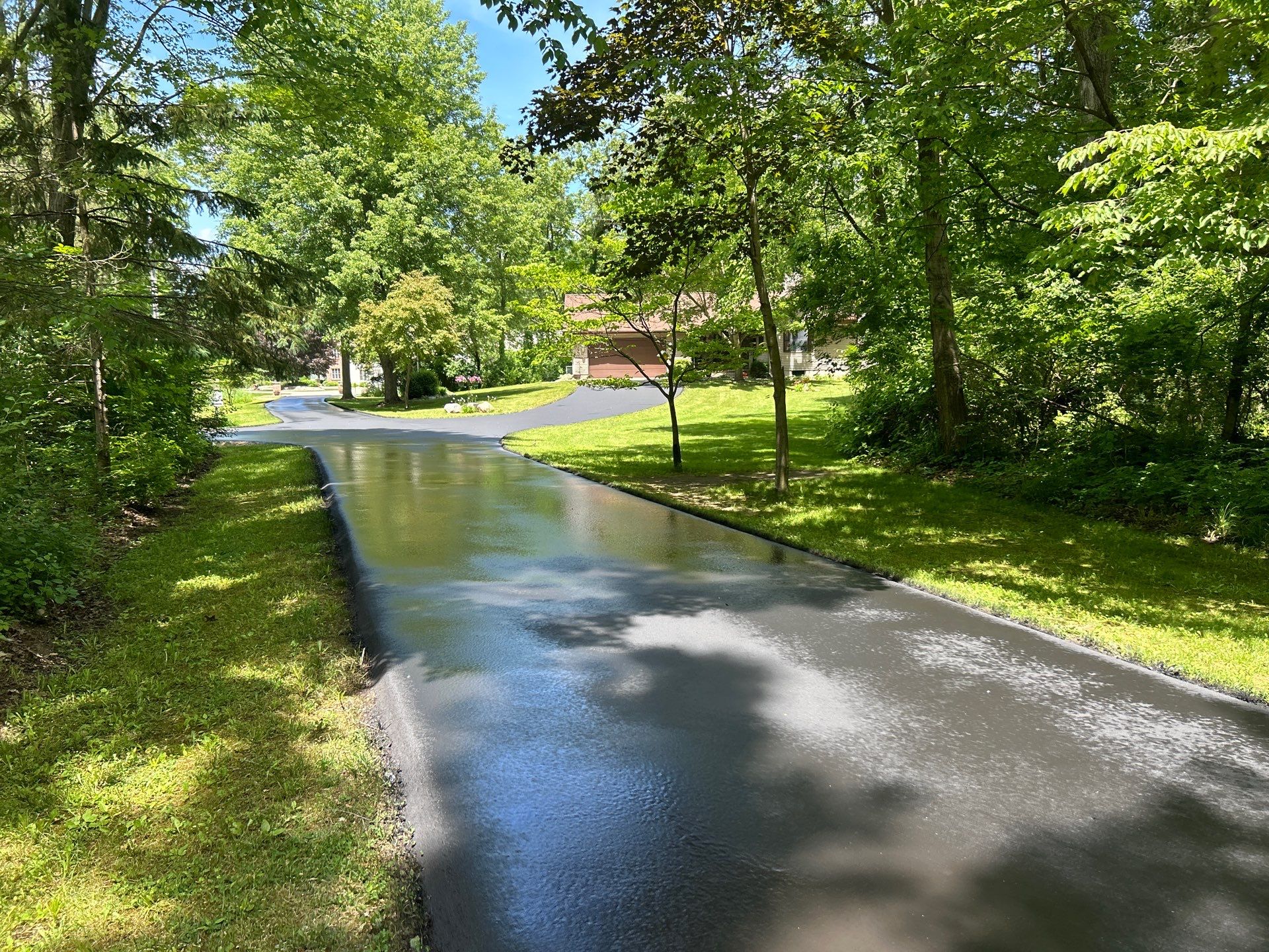 High end residential driveway by Quality Asphalt & Maintenance LLC