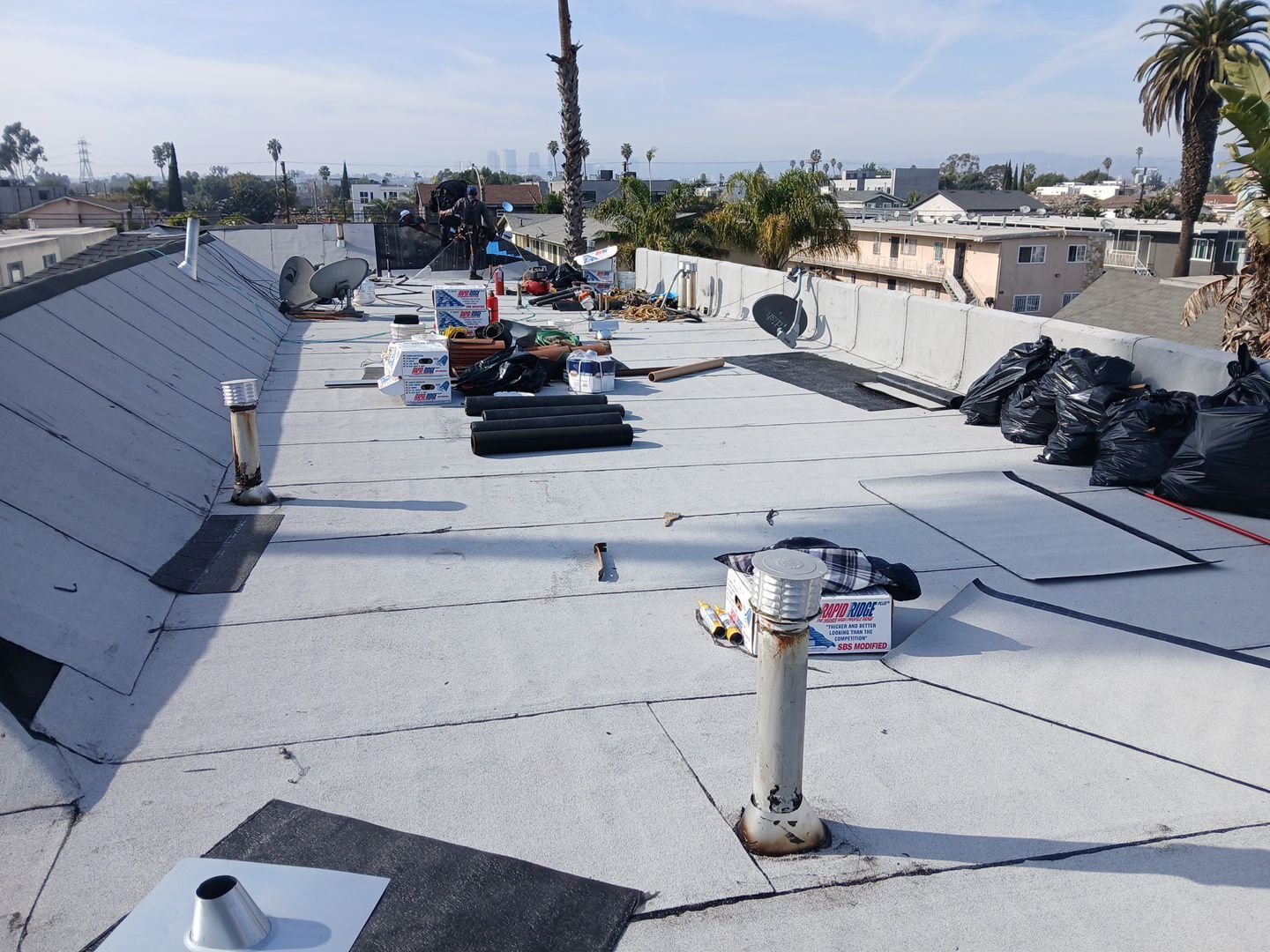 Apartment Building Roofing Installation using CertainTeed GTA Modified Bitument System by Hull Brothers Roofing