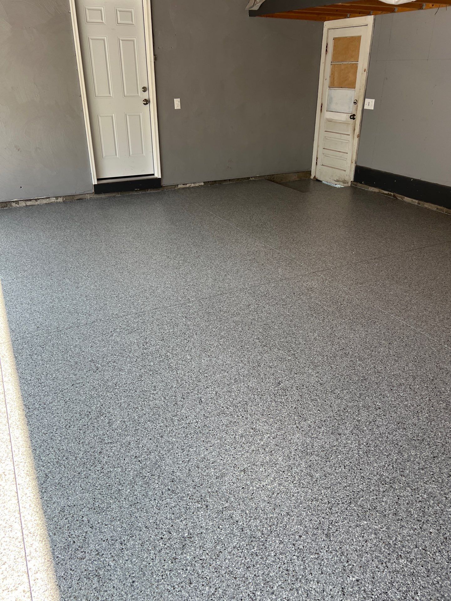 Concrete garage floor replacement and epoxy coating installed by NG Masonry & Construction LLC