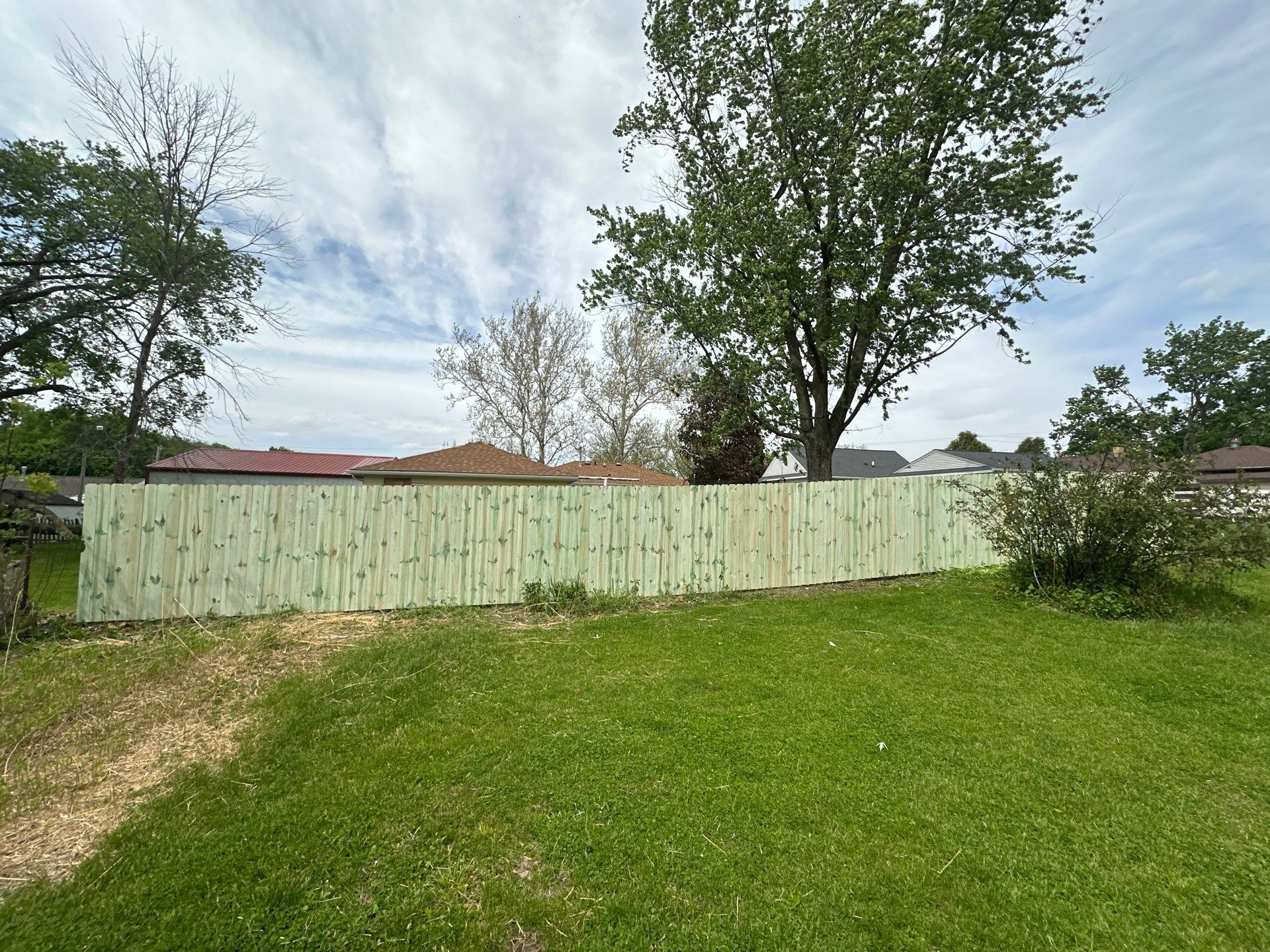 Pressure-Treated Wood Privacy Fence Installation in Waterloo by Perfect Picket Fence and Stain