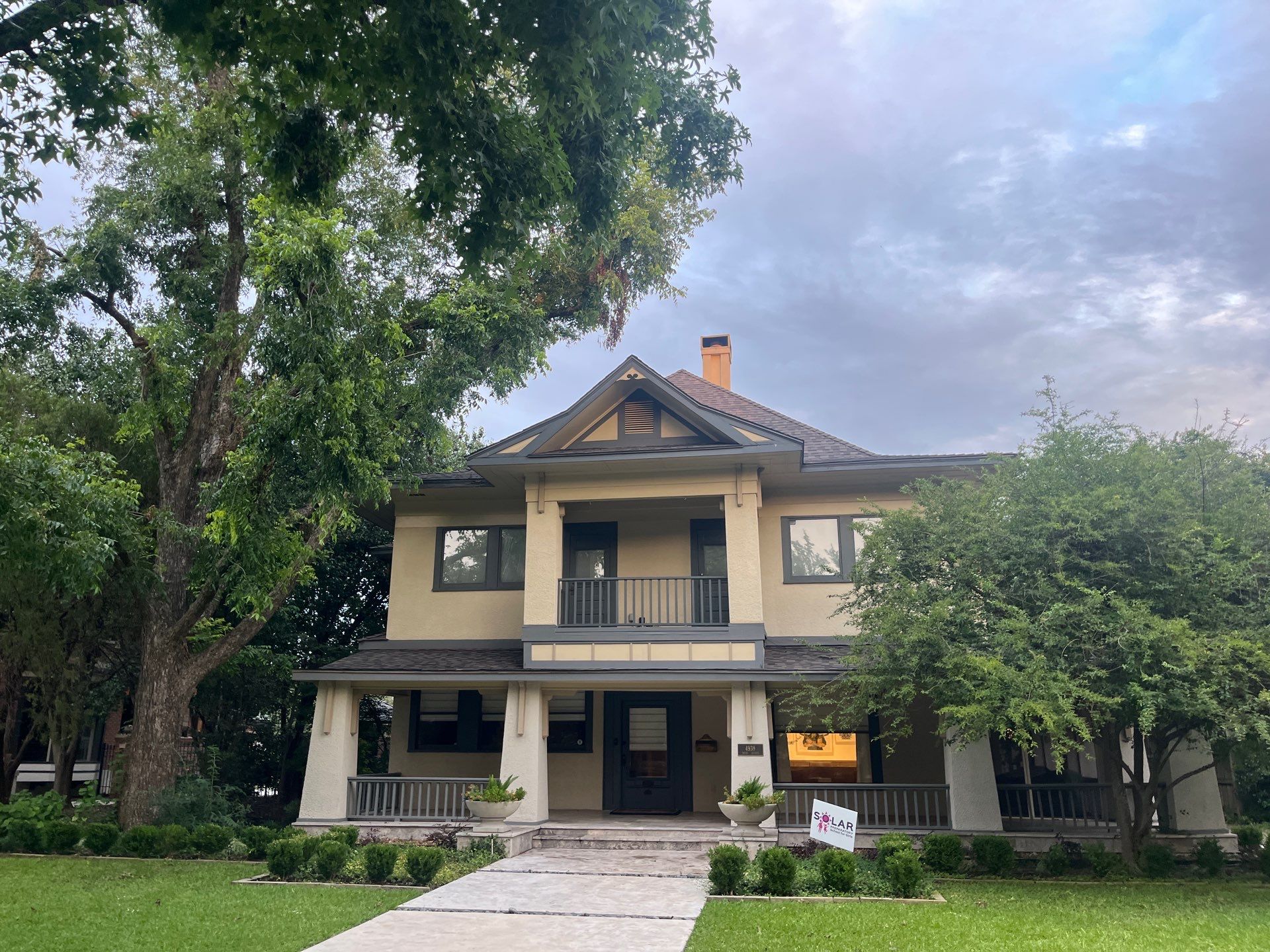 Tan exterior with IKO Driftshake by Tejas Roofworks + Restoration