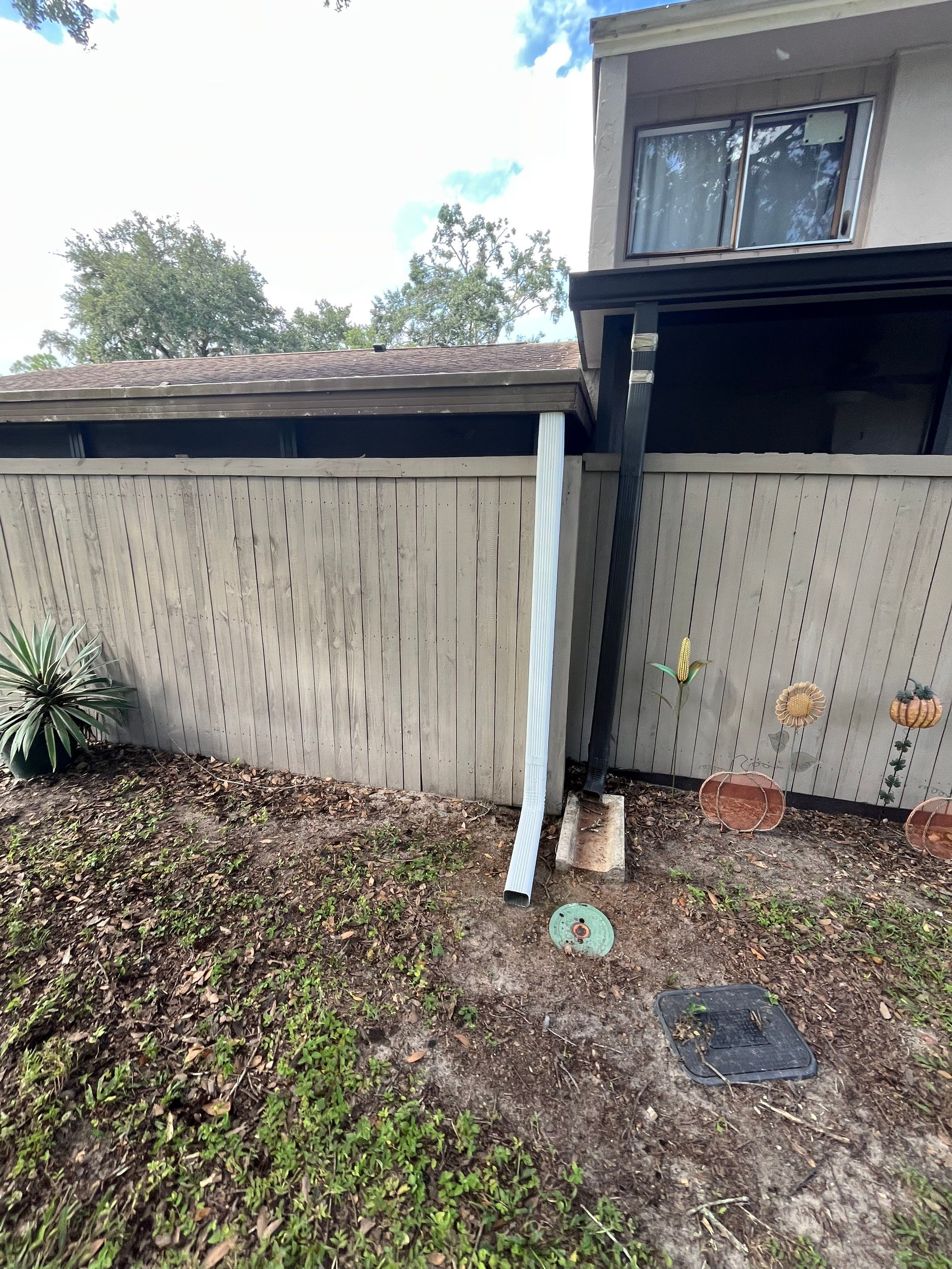 Professional Downspout Installation in Tampa, FL by Gutter Professor by Gutter Professors