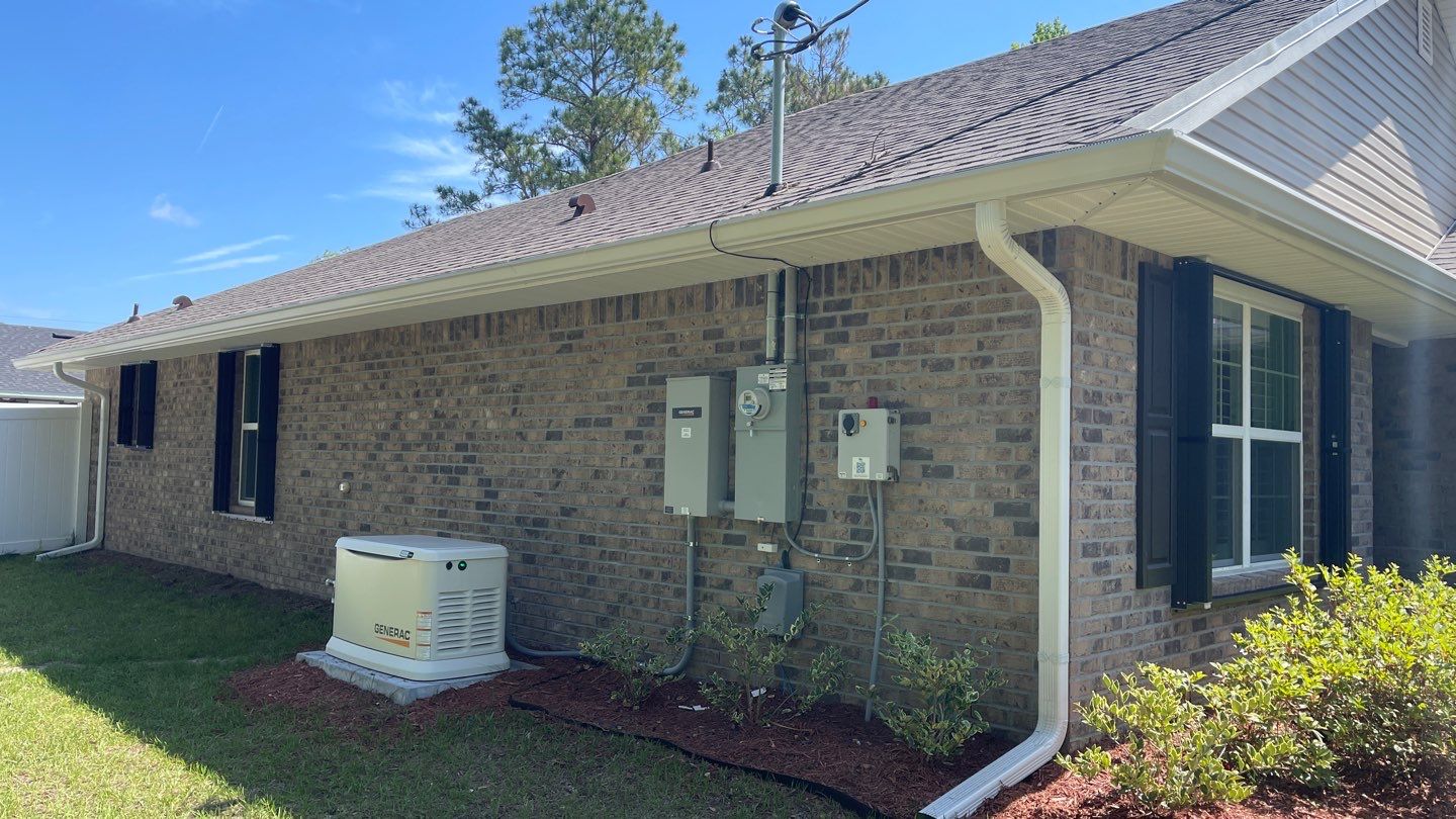 Bronze Accordions on brick home by Smart Guard Shutters