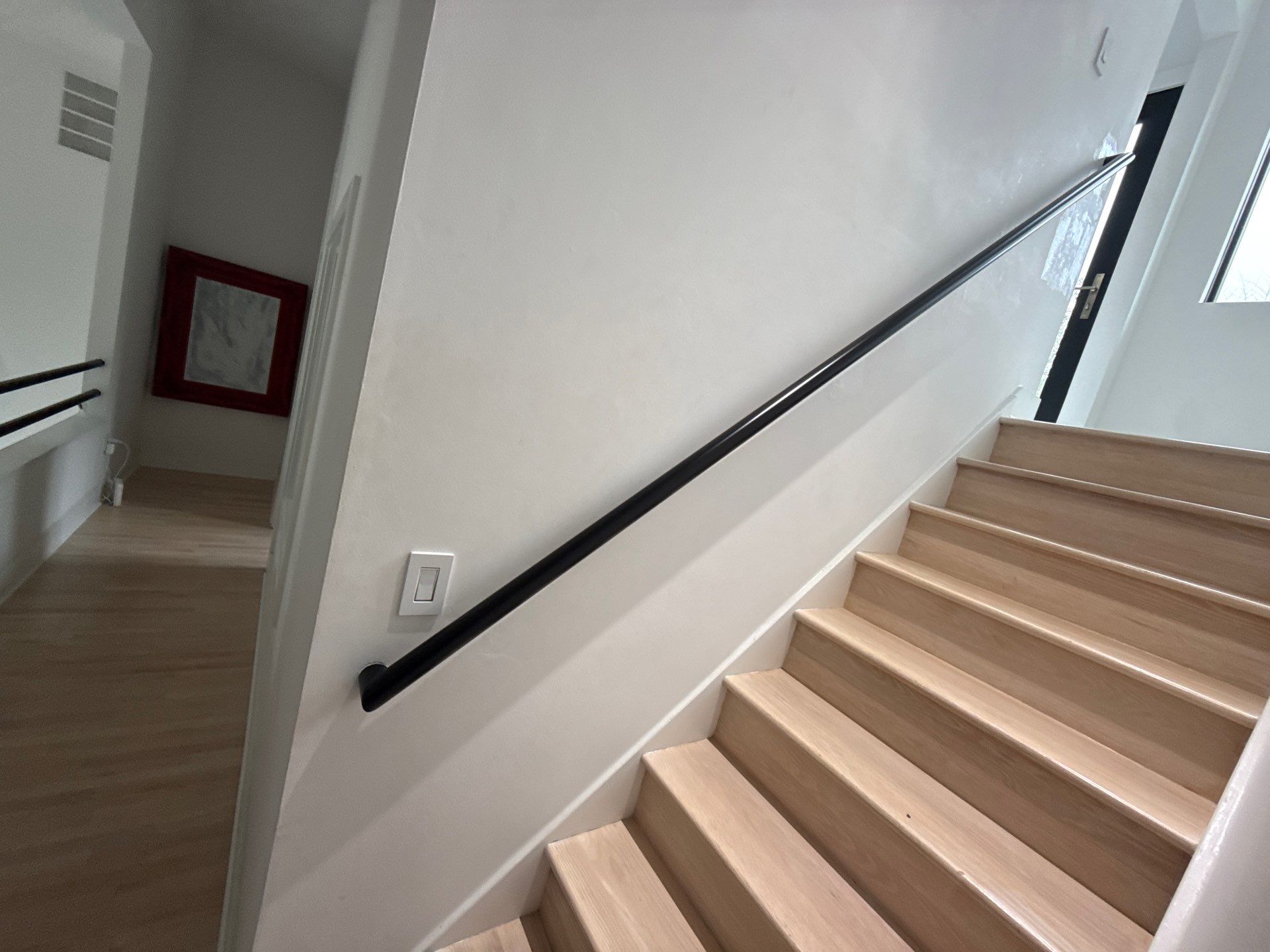 Two Black Metal Handrail Installation Across Multi-Level Washington Staircases by Capitol Iron Works