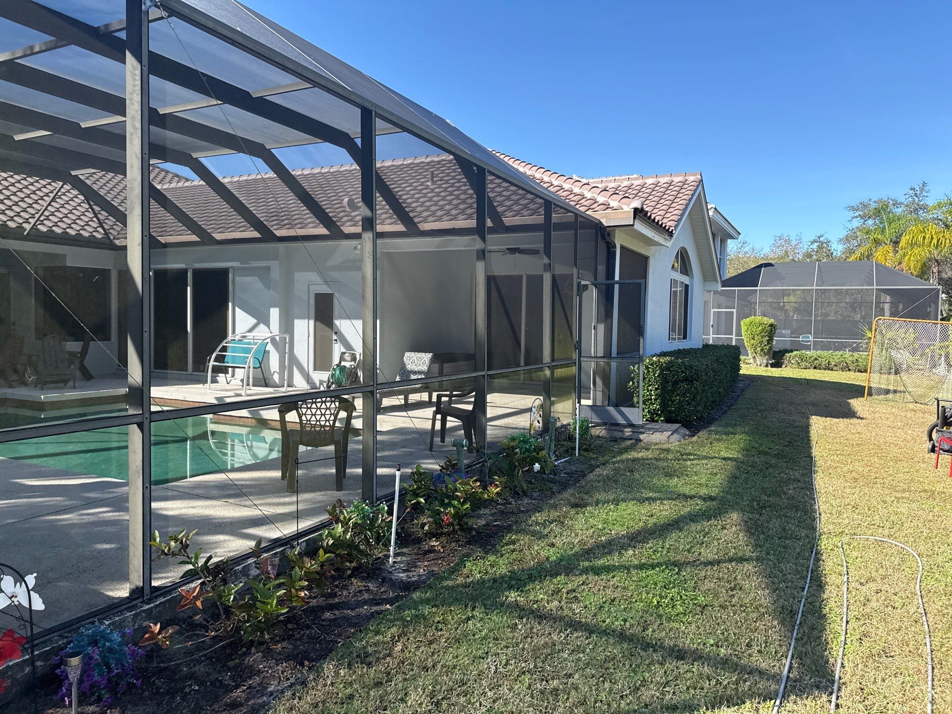 Painted Pool Deck, Lanai & Pool Cage Cleaning in River Club South – Bradenton, FL by Sunshine AquaWash