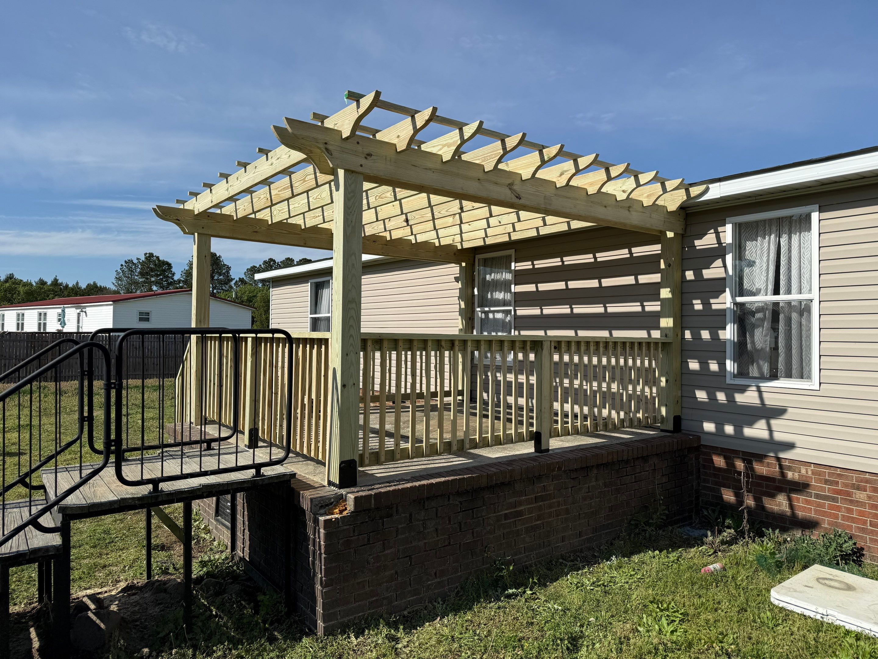 Custom Wooden Pergola and Deck Installation in La Grange, NC by The Remodeling Company
