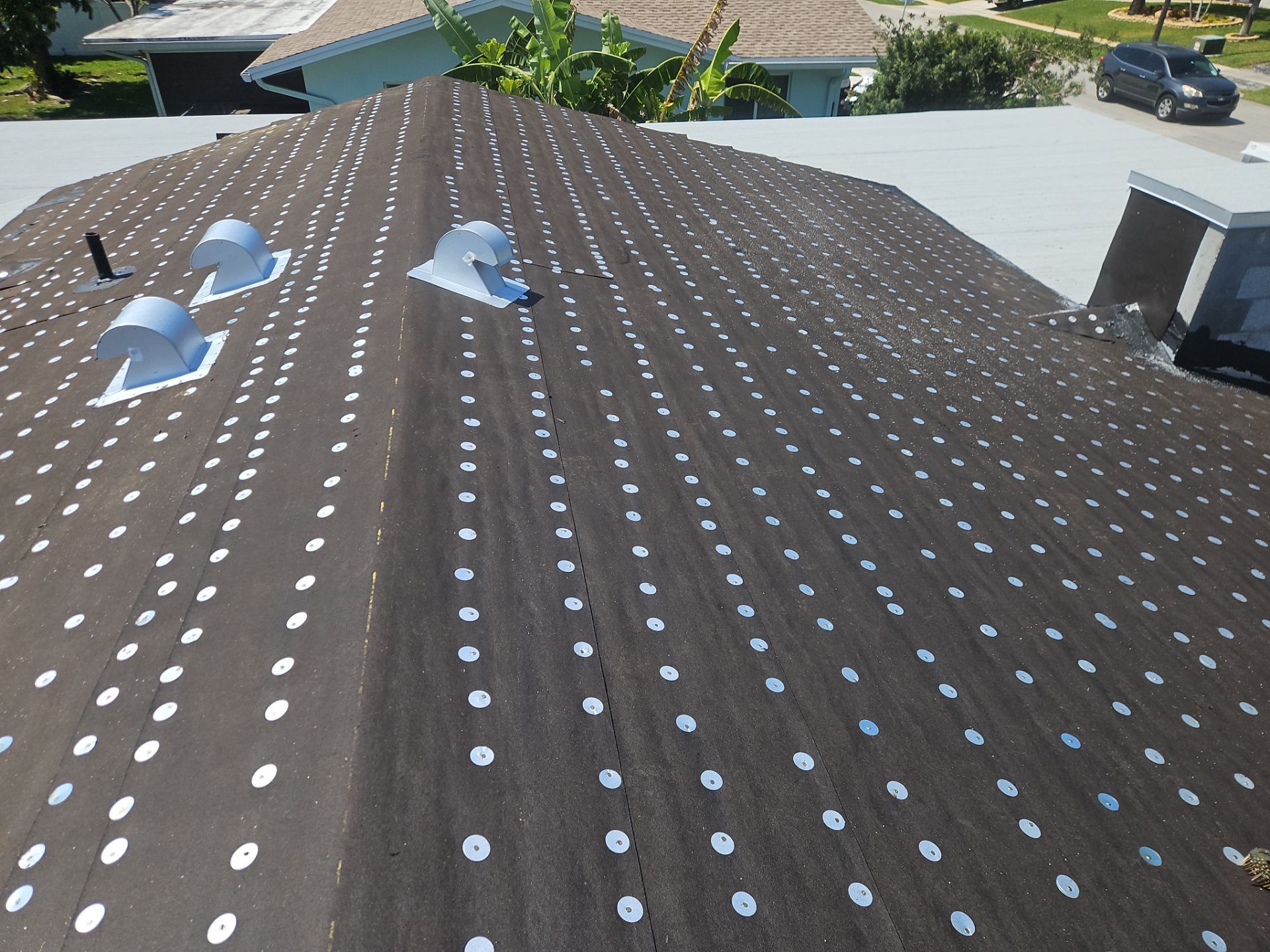 Residential Roofing Installation using 1" Nail strip metal roof by BLUES BROTHERS ROOFING