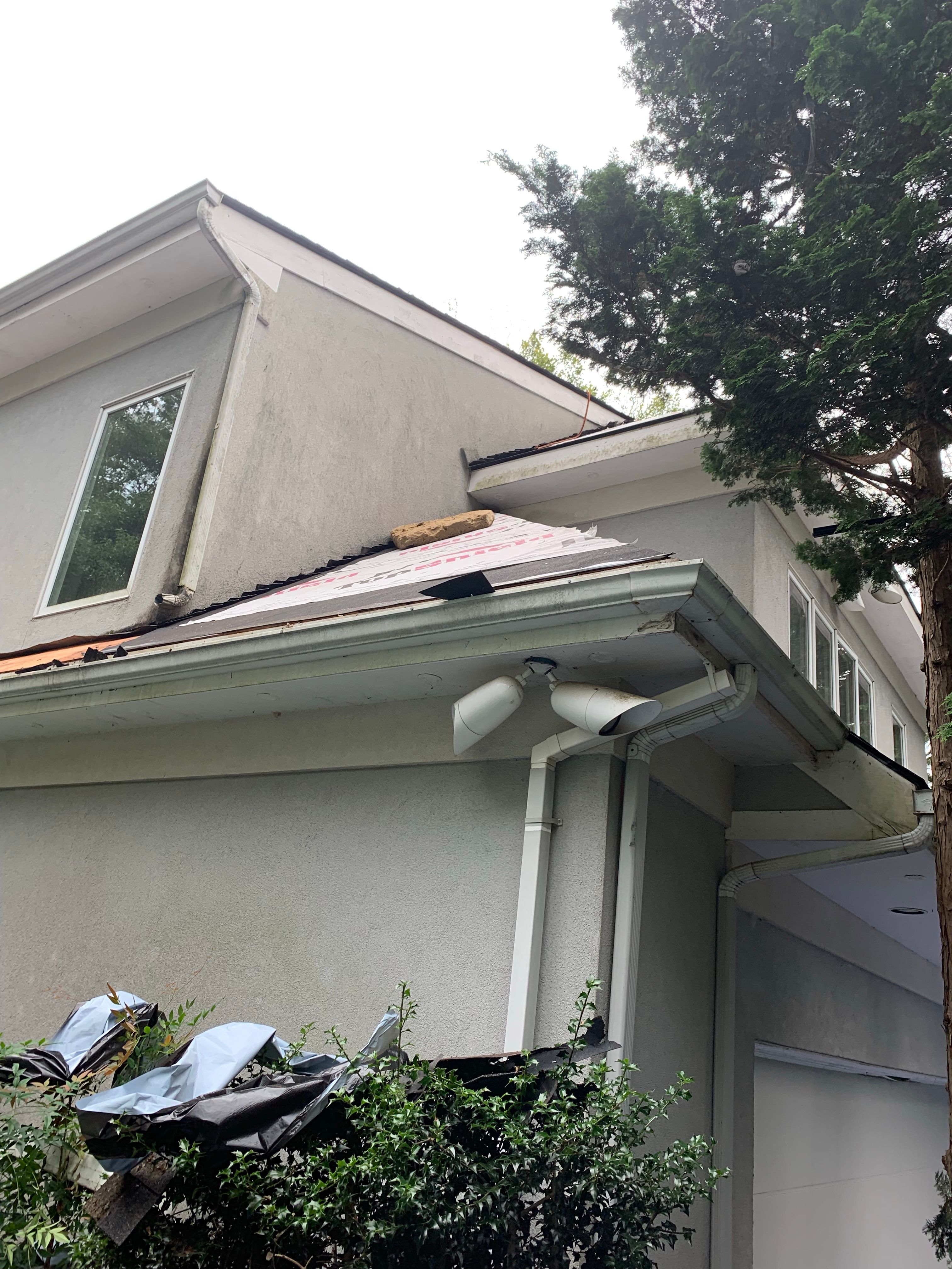 Skylight, Roof, and Gutter Replacement by American Home Contractors