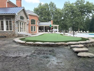 Custom Backyard Golf Green Accented by Flagstone Border in Morrow, OH
