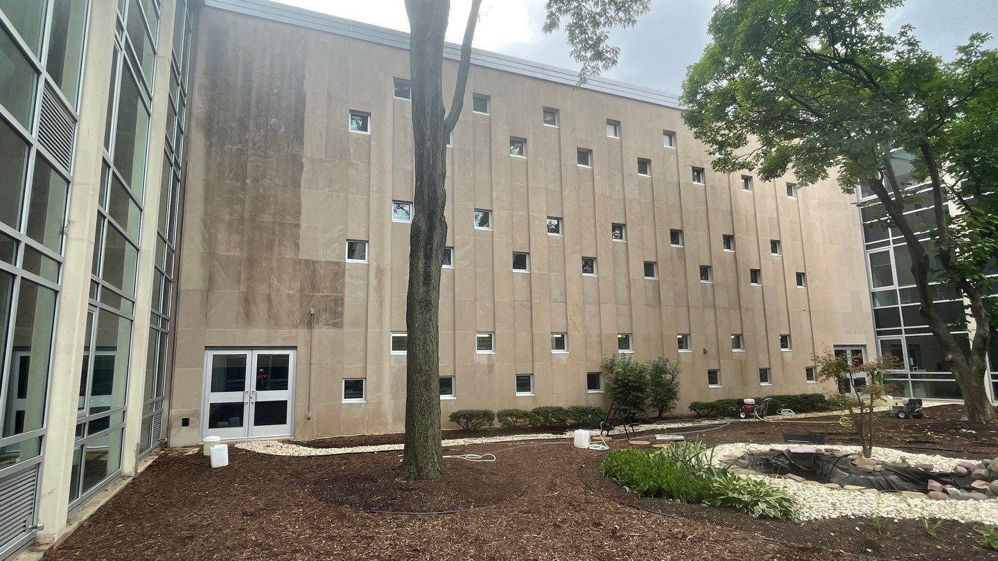 Courtyard pressure washing difficult access.  by Northern Power Washing LLC.