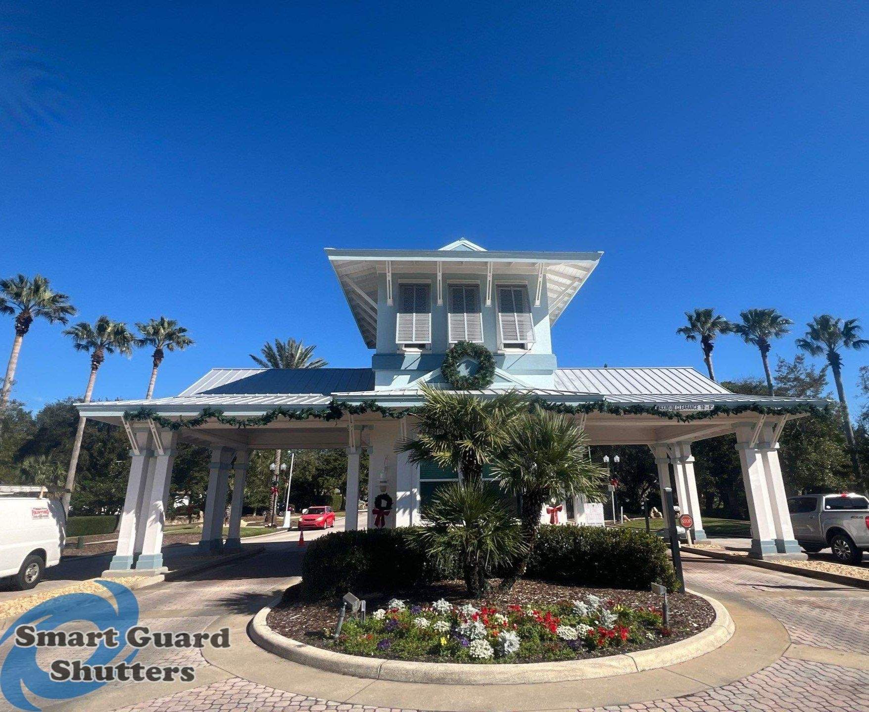 Decorative Bahama Shutters in Window Grey by Smart Guard Shutters