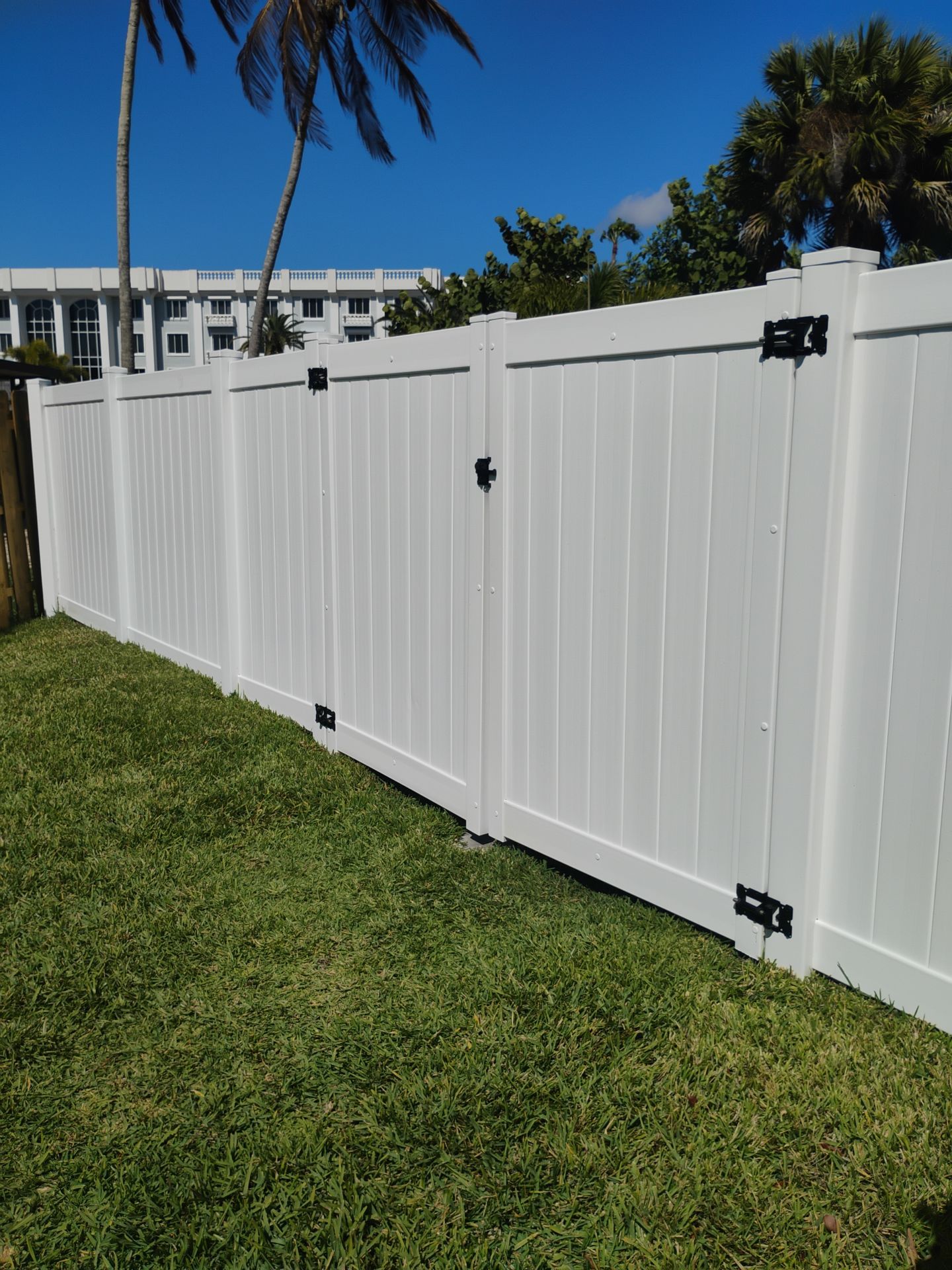 White Vinyl Privacy Fence and Double Gate Installation in Fort Myers by True Fence LLC