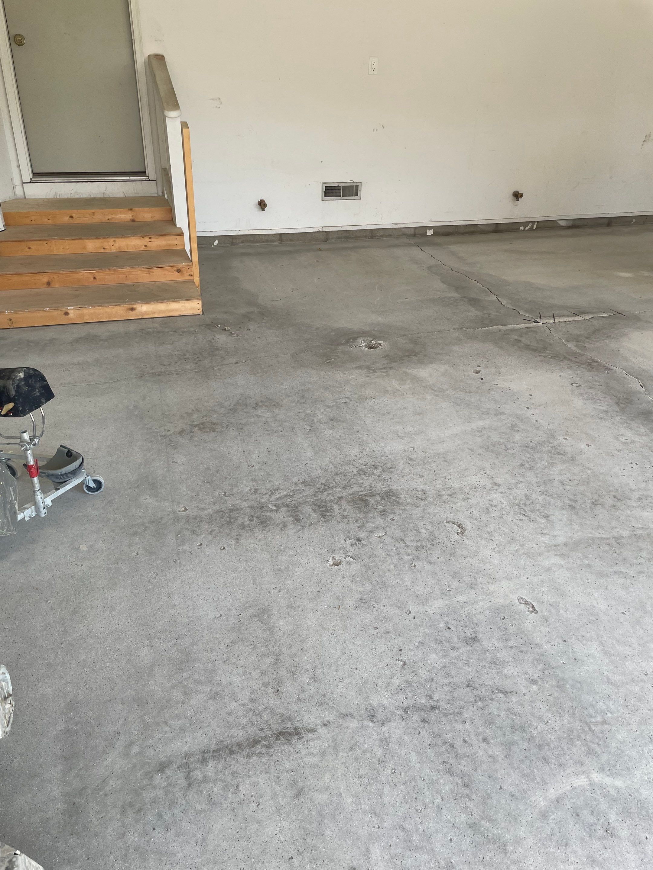 Grey Speckled Concrete Coating for Residential Garage in Yankton by Select Painting, Coatings & Garage Cabinets
