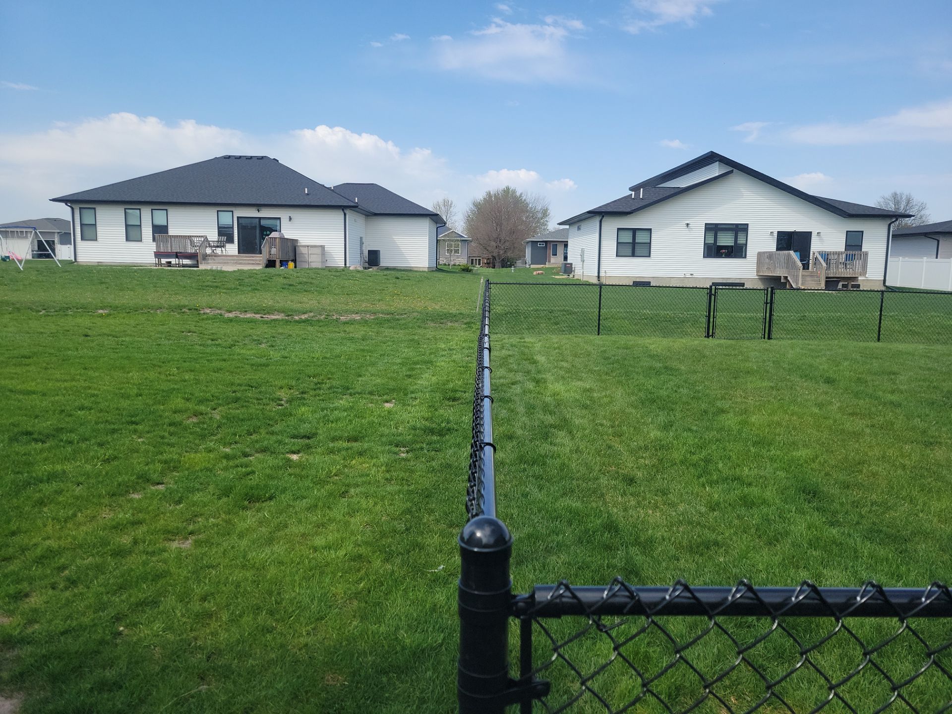 Black Chain Link Fence and Gate Installation in Cedar Falls by Perfect Picket Fence and Stain