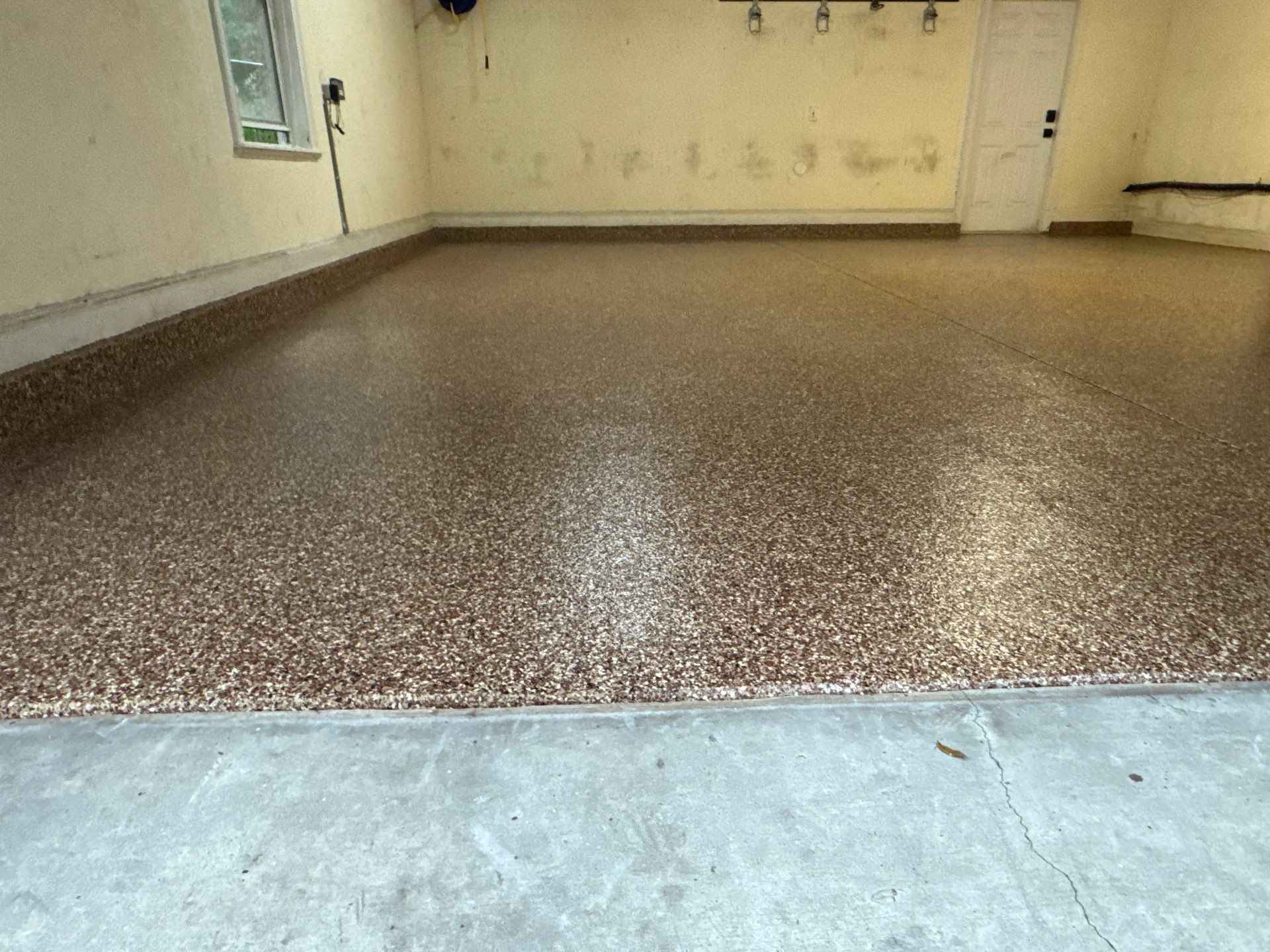 Garage Project in Newberry, FL in Chestnut by Cross Creek Concrete Coatings
