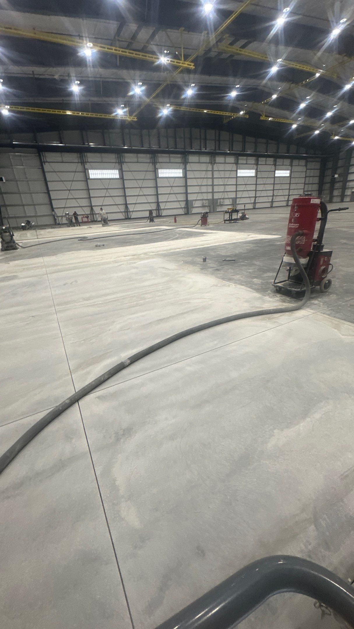 Airplane Hanger using Light Grey Commercial Penntek Epoxy by Croc Coatings, LLC