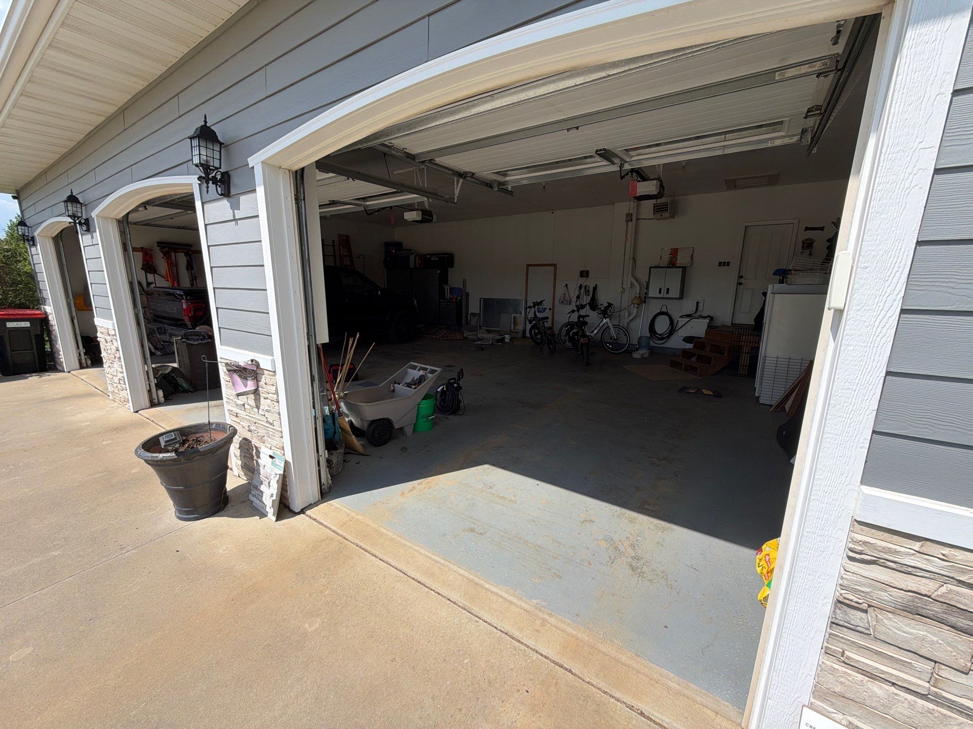 Feather Grey Garage Floor Coating Installation in Valley Springs by Select Painting, Coatings & Garage Cabinets