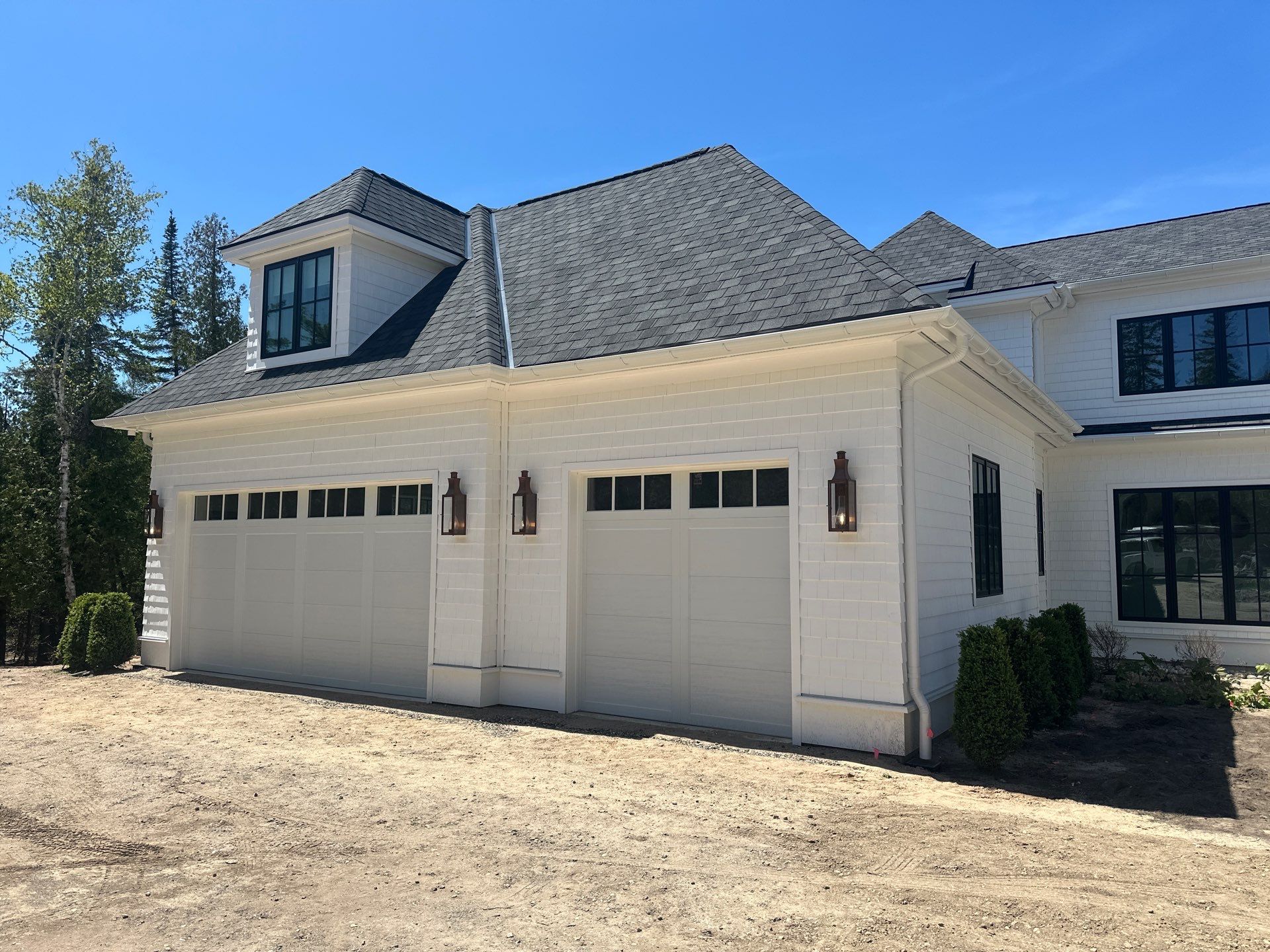 Gutter System and Exterior Drainage Installation in Charlevoix by Rainbow Seamless Systems