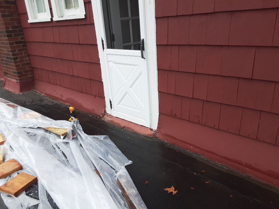 Residential Roof Replacement using Patio Roof by Absolute Roofing and Construction