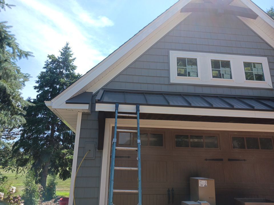 Garage Metal Roof using Standing Seam Metal by Absolute Roofing and Construction