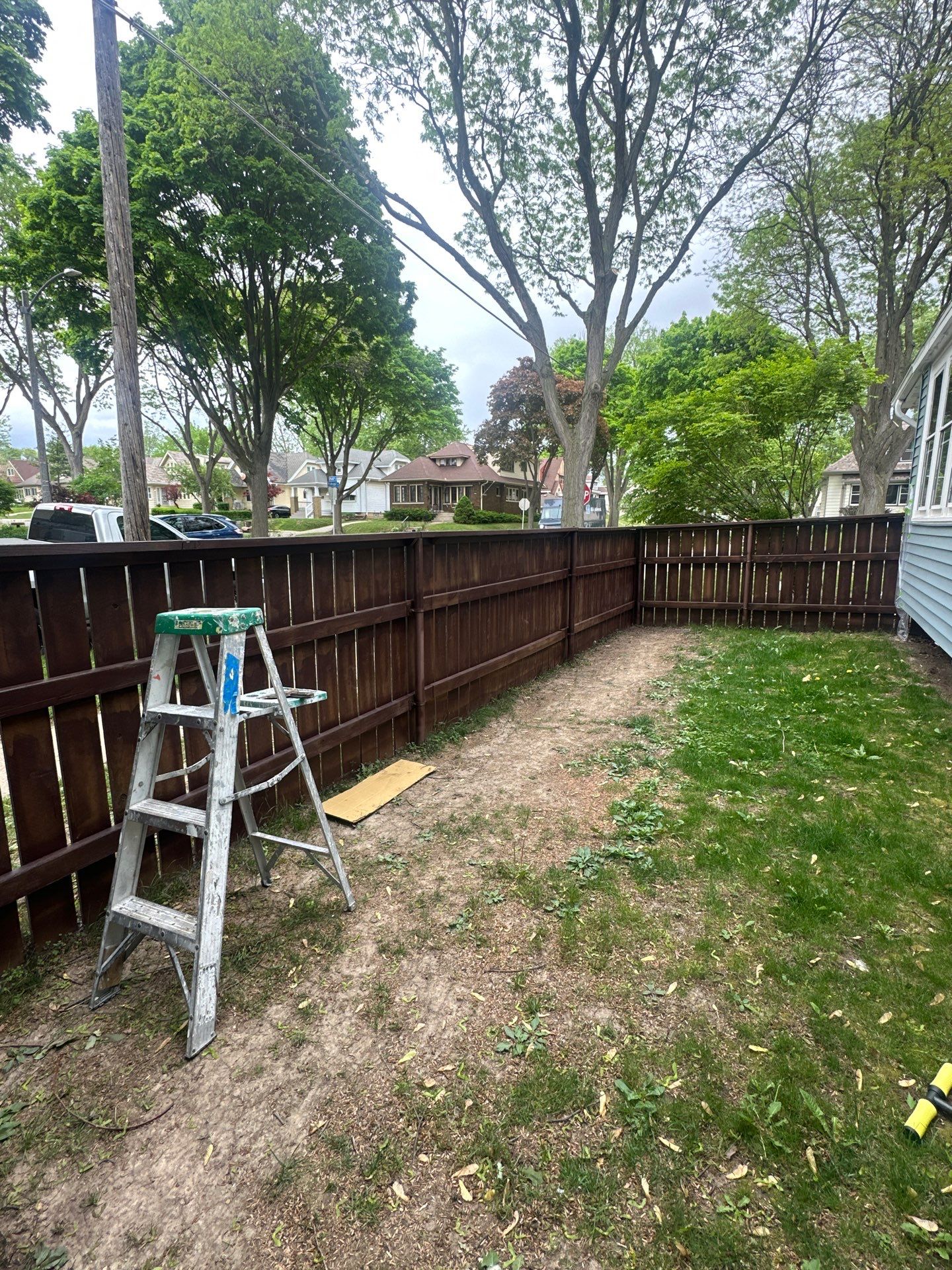 Exterior Porch Restoration and Privacy Fence Staining in Wauwatosa by OCS Contracting Services