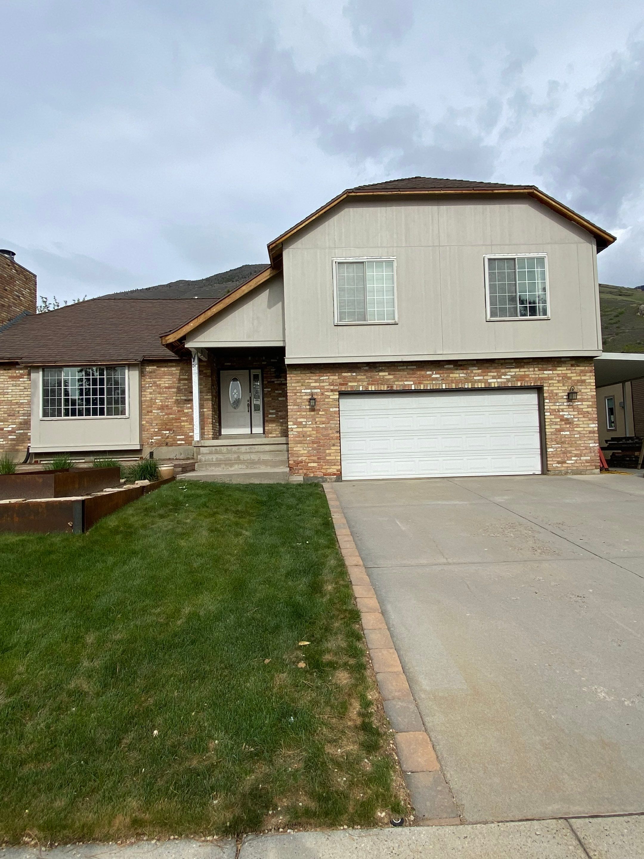 Cottonwood Heights | Custom Hardie Exterior & Bold Fascia | Cobble Stone Accents by Ideal Siding Utah
