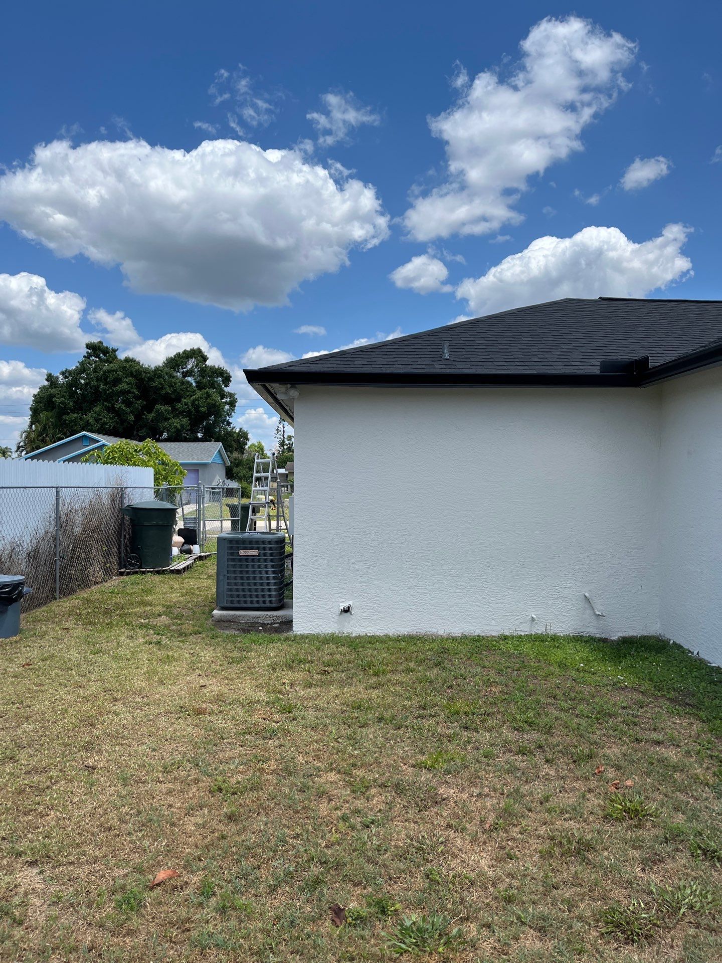 Black Seamless Gutters and Downspouts in Fort Myers FL by Gutter Professors