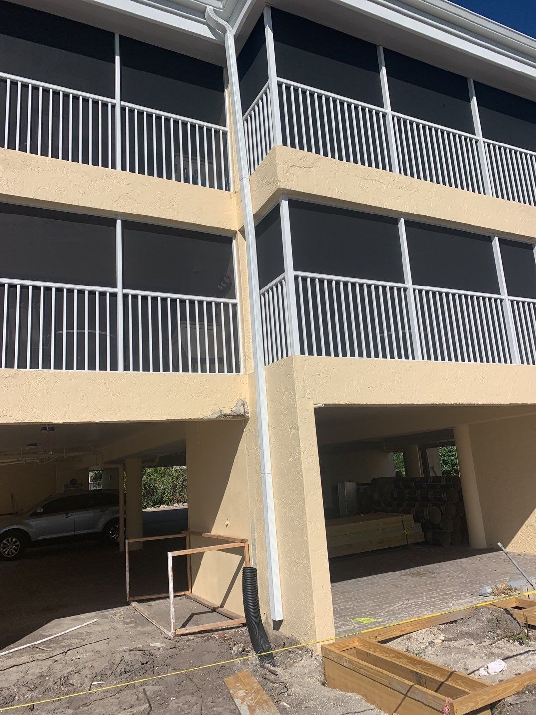 White Seamless Gutters and Downspouts in Sanibel FL by Gutter Professors