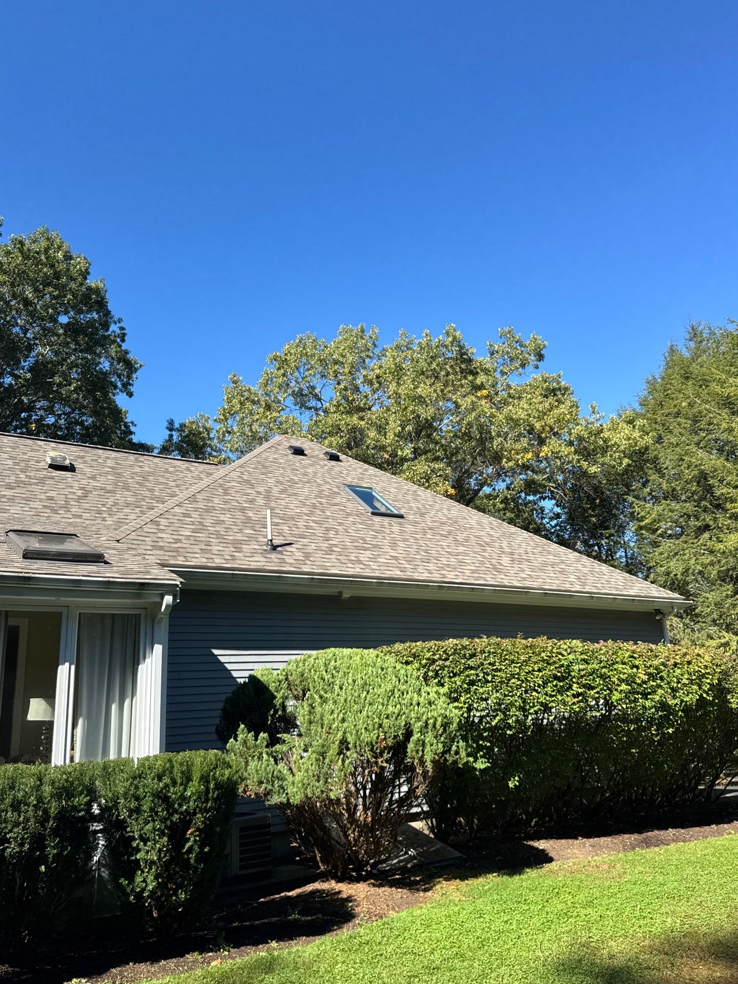 Full Asphalt Shingle Roof Replacement with Skylight Flashing – Concord, MA by Mighty Dog Roofing of Greater Middlesex County