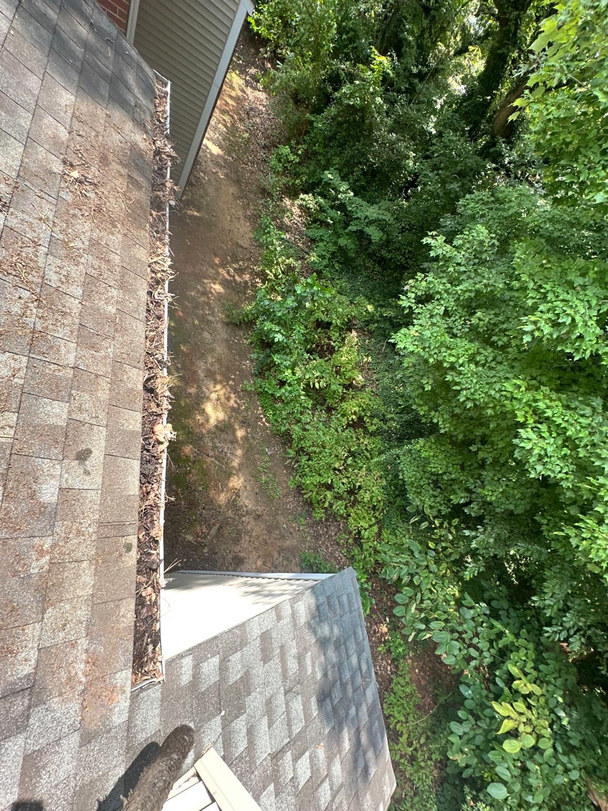 Commercial gutter cleaning High Point, NC before photo with filled gutters