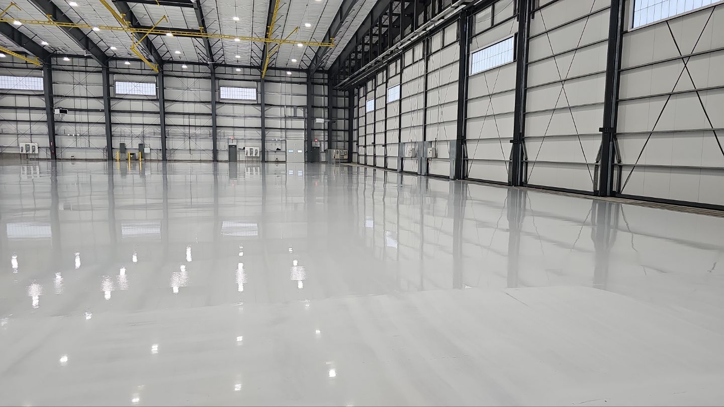 Airplane Hanger using Light Grey Commercial Penntek Epoxy by Croc Coatings, LLC