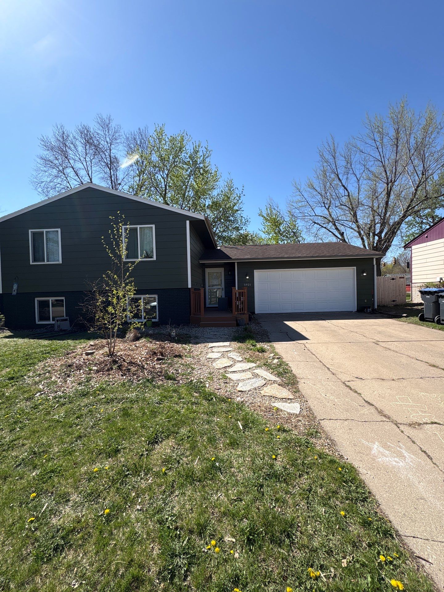 Full Exterior House Painting and Foundation Refinishing in Sioux Falls by Select Painting, Coatings & Garage Cabinets