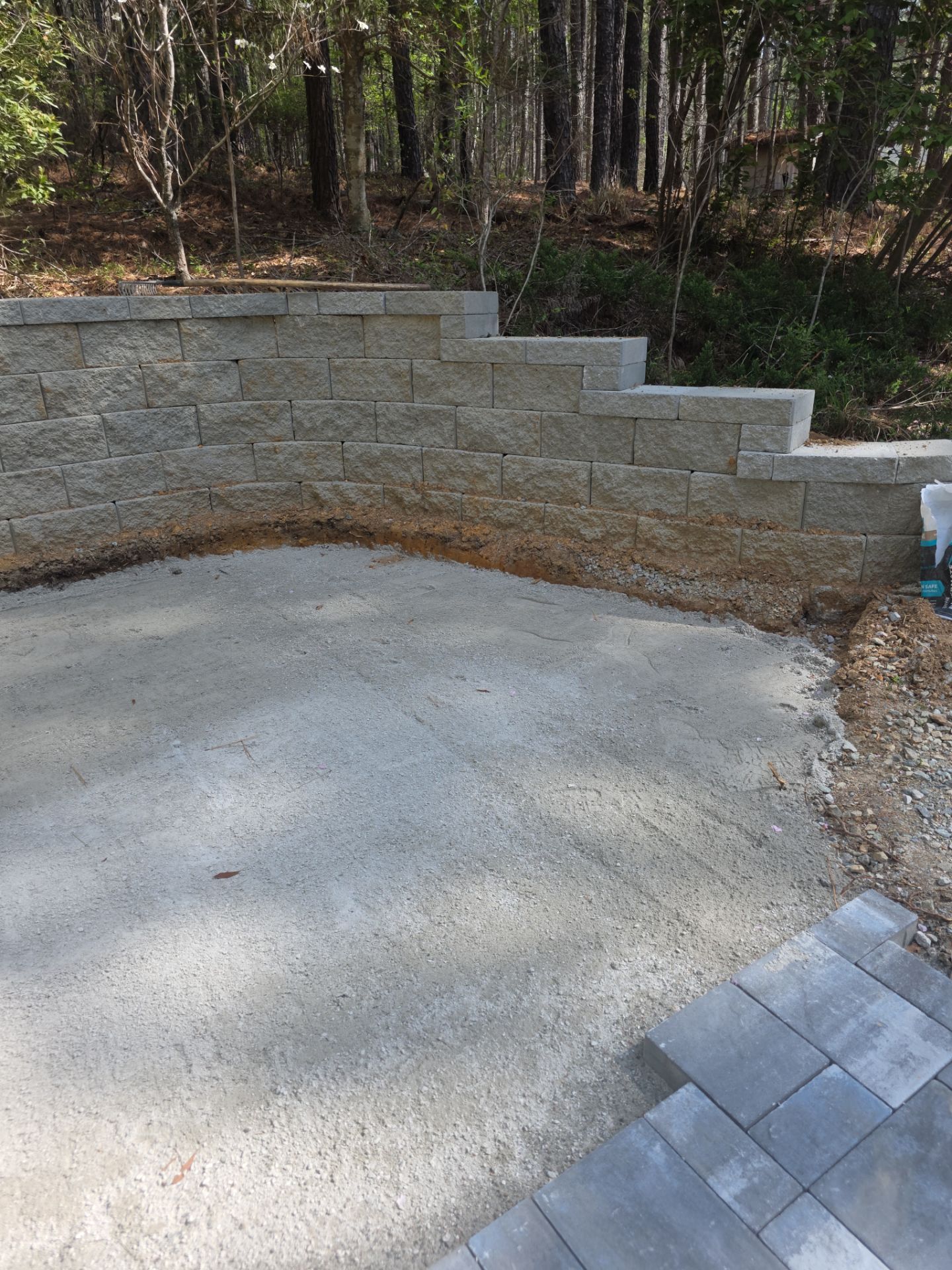 Pittsboro Outdoor Living Transformation – Retaining Wall, Paver Patio & Elevated Deck by Elite Remodeling and Design LLC
