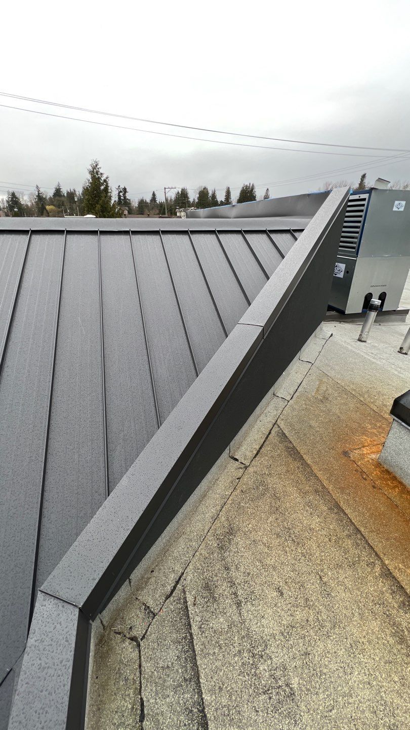Commercial Roofing Installation using 12" Prolok metal and hidden gutters! by Top Notch Roofing Inc