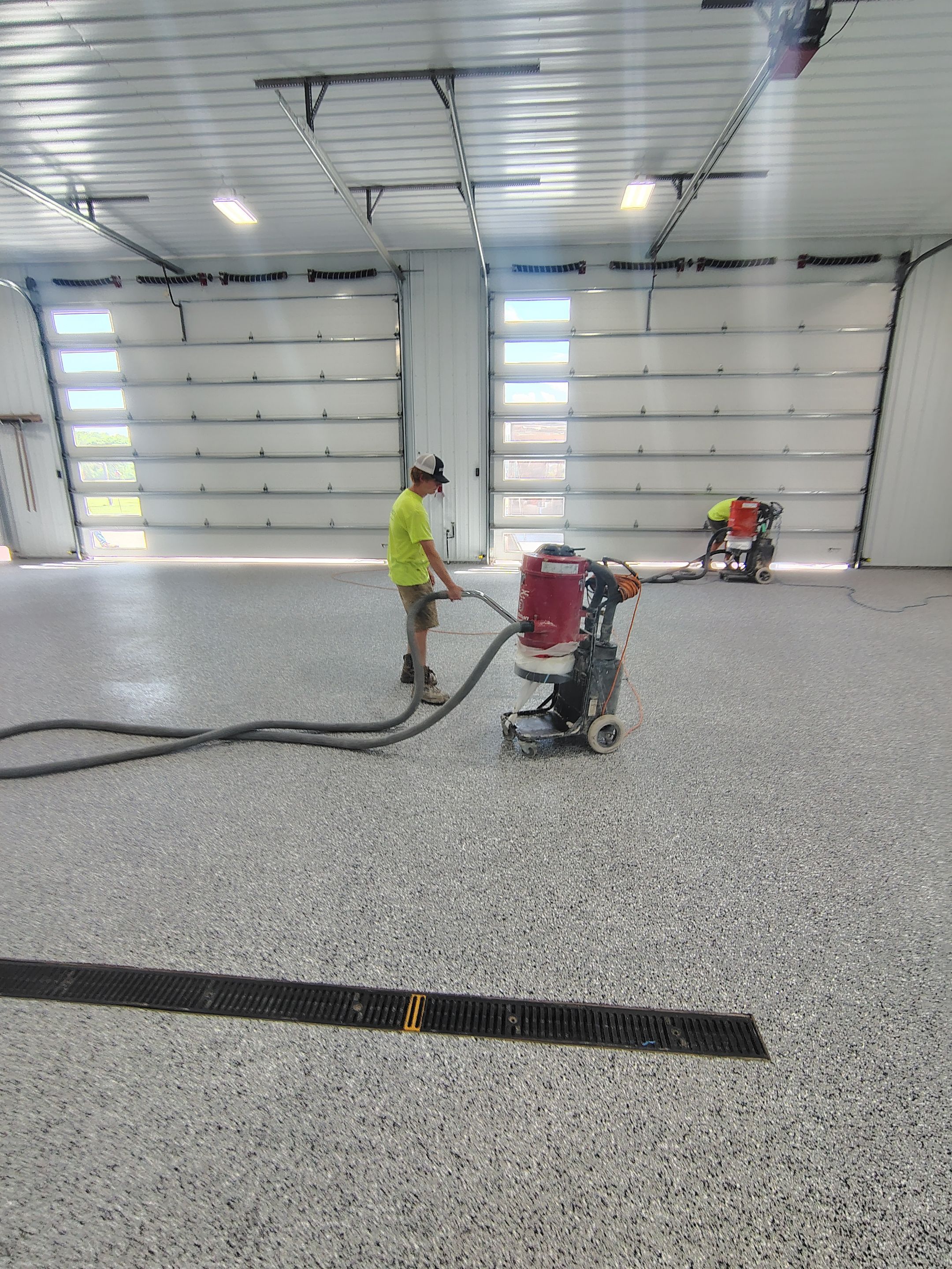 Multi-Stage Concrete Floor Coating for Egan Shop and RV Storage by Select Painting, Coatings & Garage Cabinets