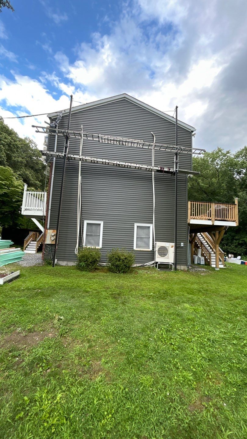 Siding Renewal Using Provia Cedar Peaks D 4.5 in Woodgrain and Tando Brick Panels by DiGiorgi Roofing and Siding Inc