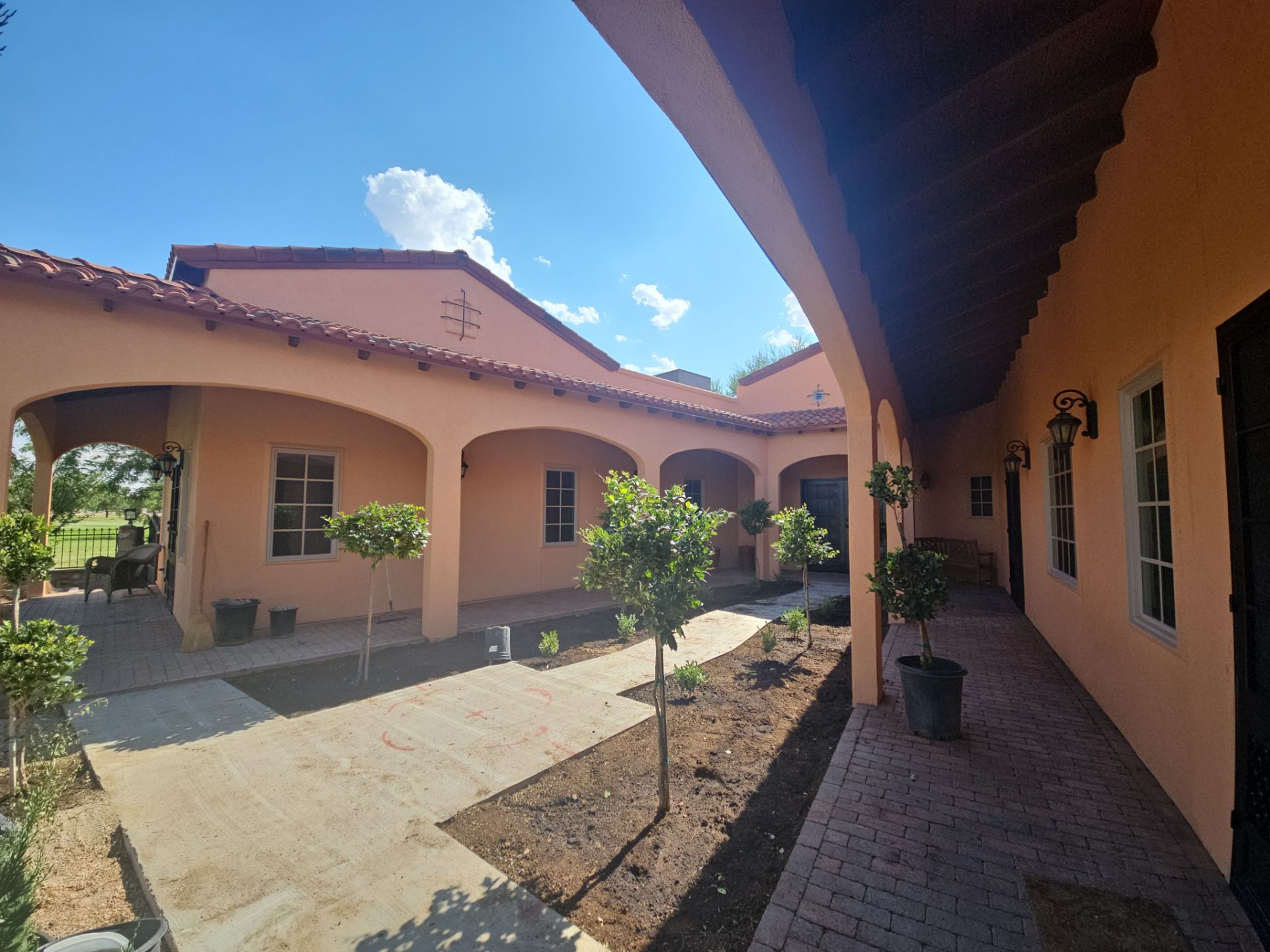Exterior Painting with Stucco Damage by Regal Renovate
