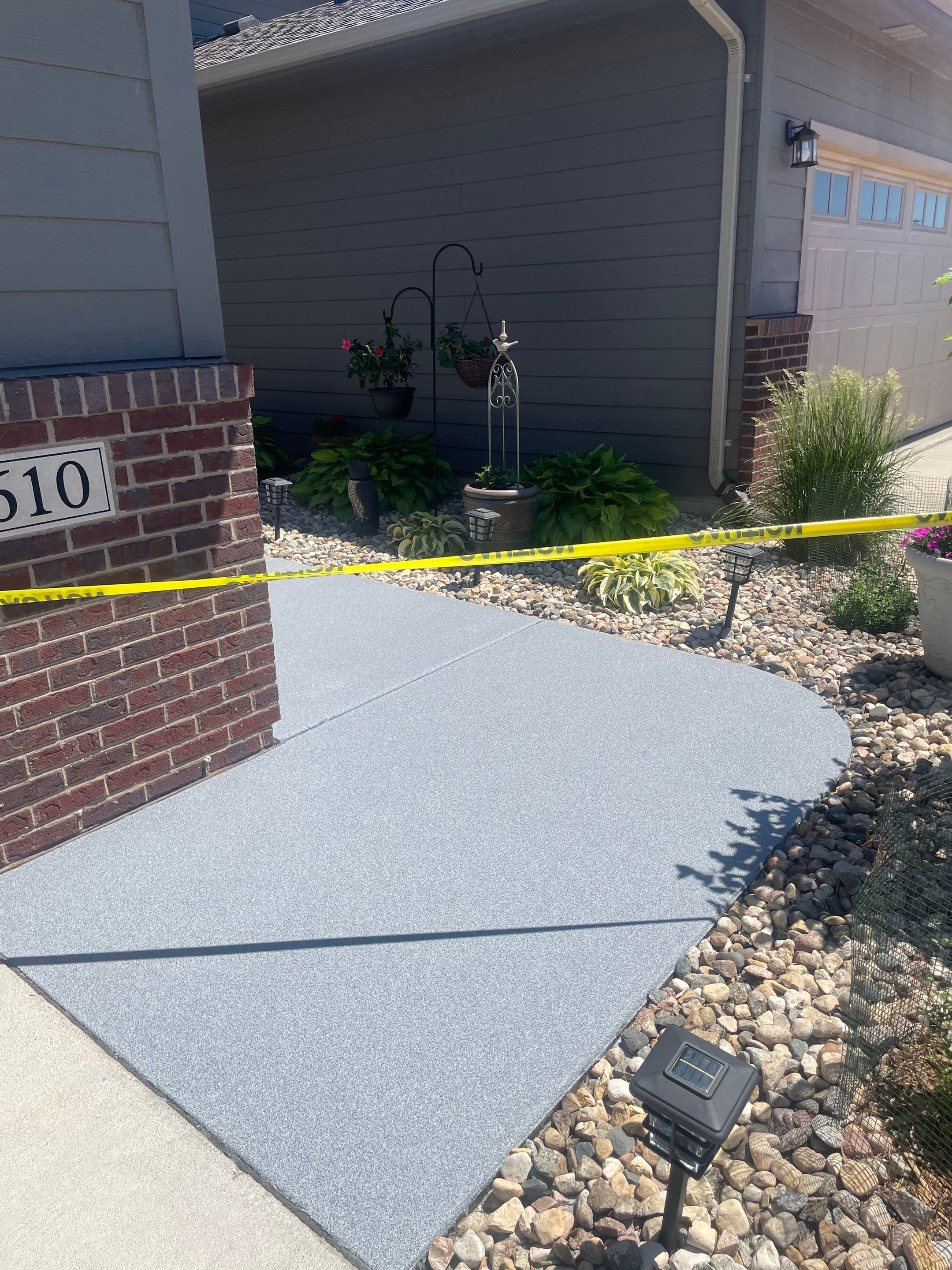 Custom Concrete Coating for Sioux Falls Patio and Front Walkway by Select Painting, Coatings & Garage Cabinets