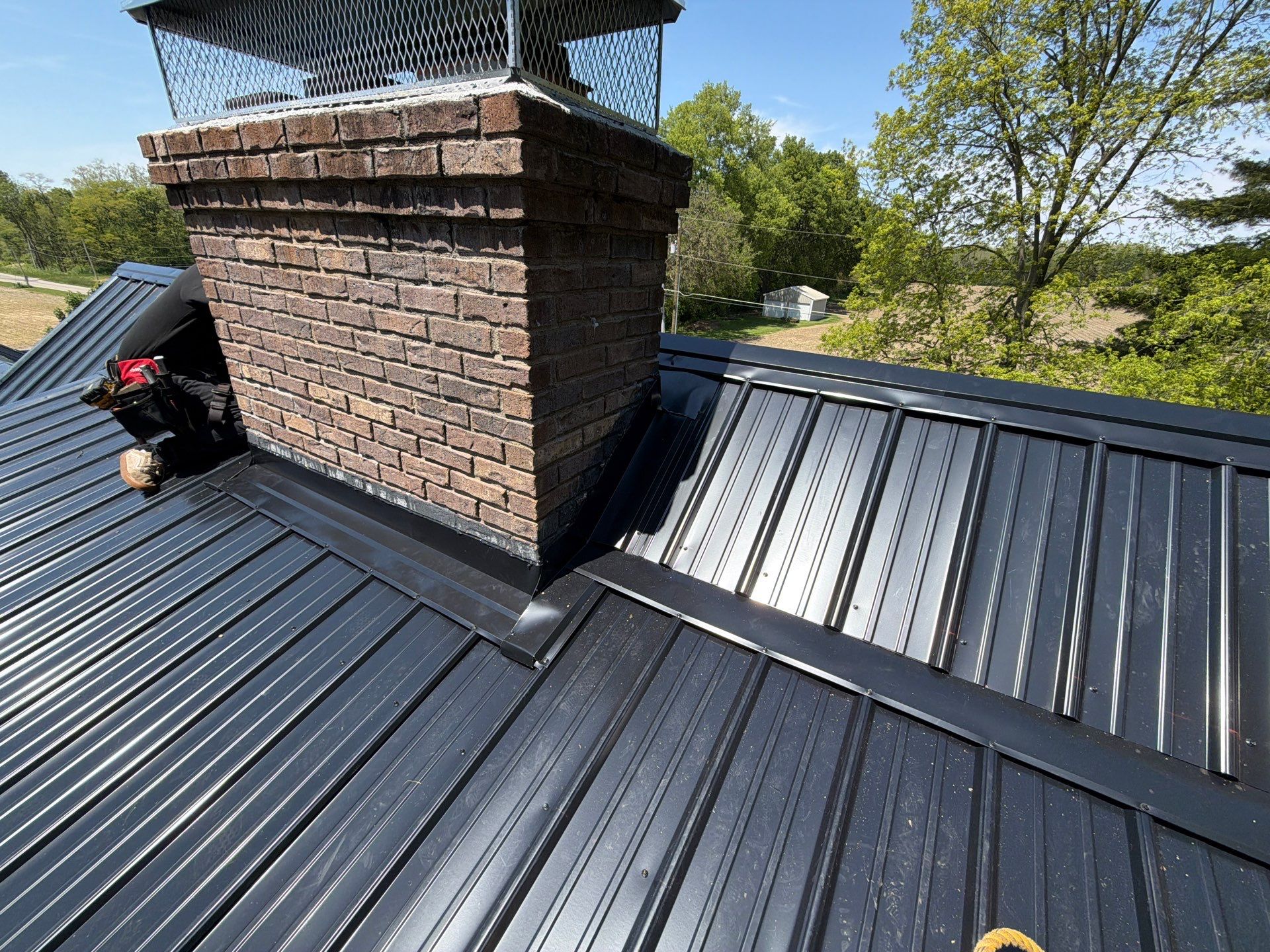 Classic Rib Metal Roofing - Shiny Black by Hoel Roofing & Remodeling