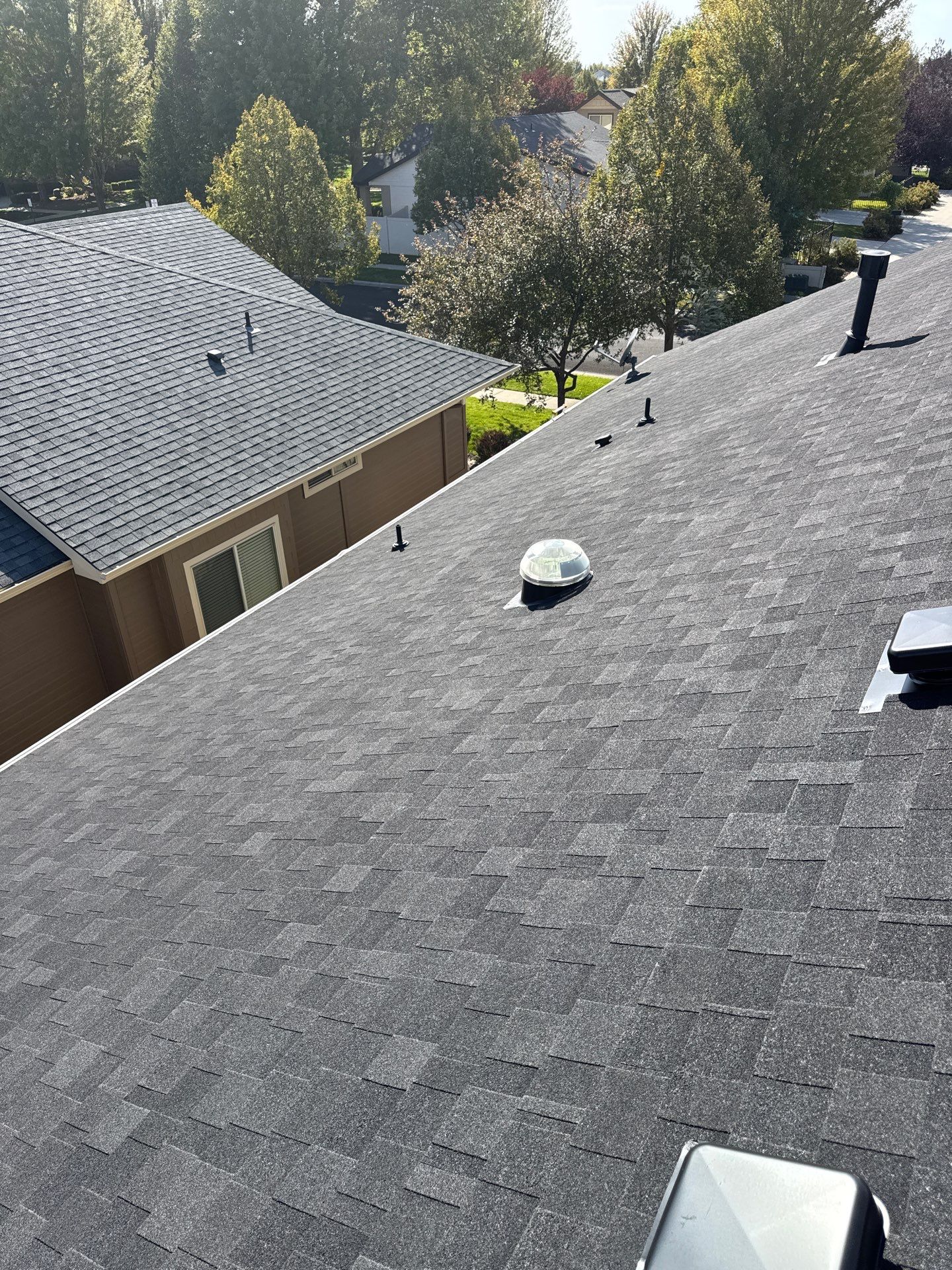 Residential Roof Replacement With Charcoal Architectural Shingles in Meridian by Olive Roofing