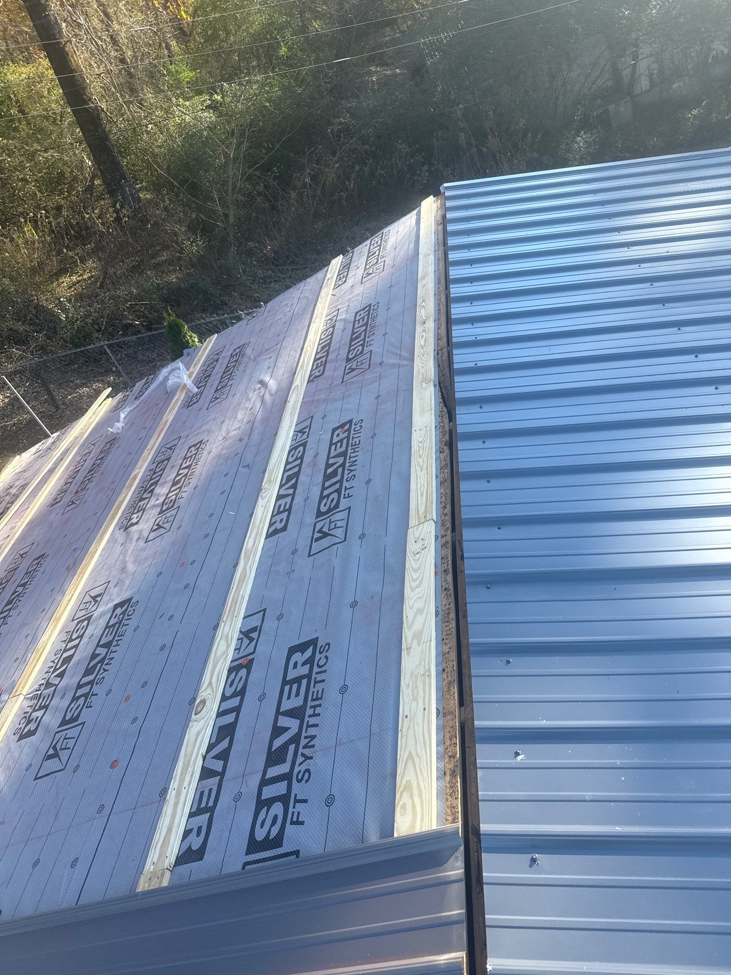 Roof Replacement in Pinson (Metal Roof) by The Roofing Dudes