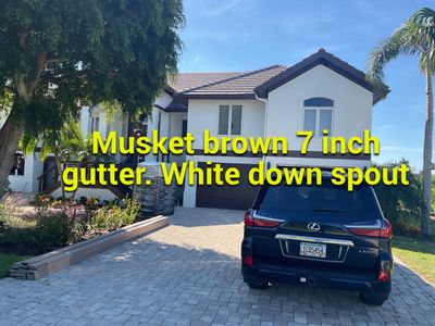 Musket Brown 7-Inch Gutters and White Down Spouts in Sanibel FL