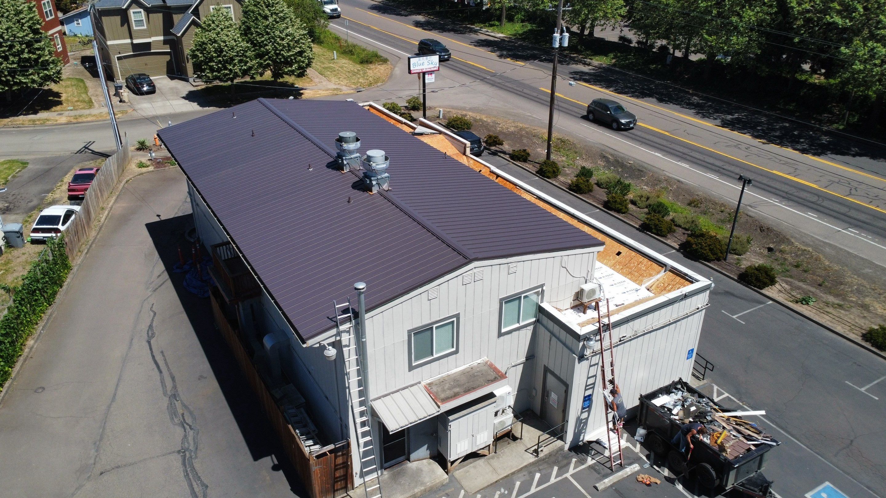 Commercial Flat Roof Installation using Bruce and Dana Snap Lock Metal (Color: Brown) by Orezona Building & Roofing Company, Inc.