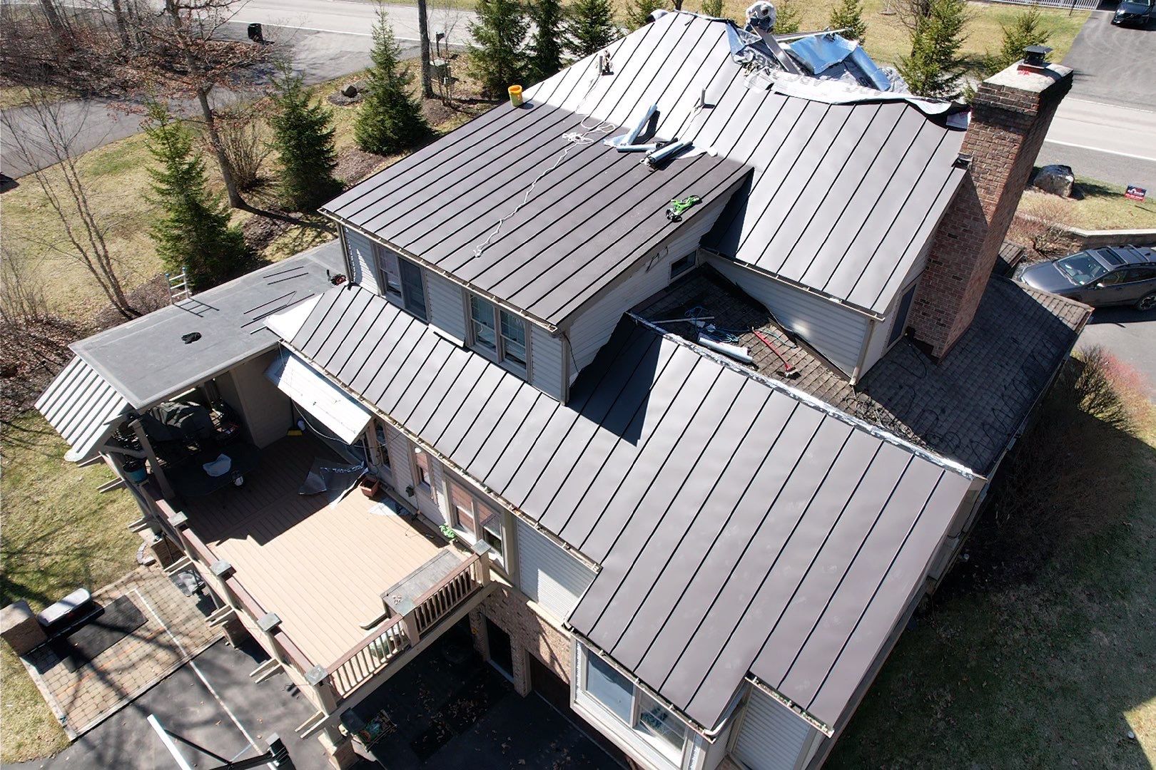 Metal Roof Replacement  by American Home Contractors