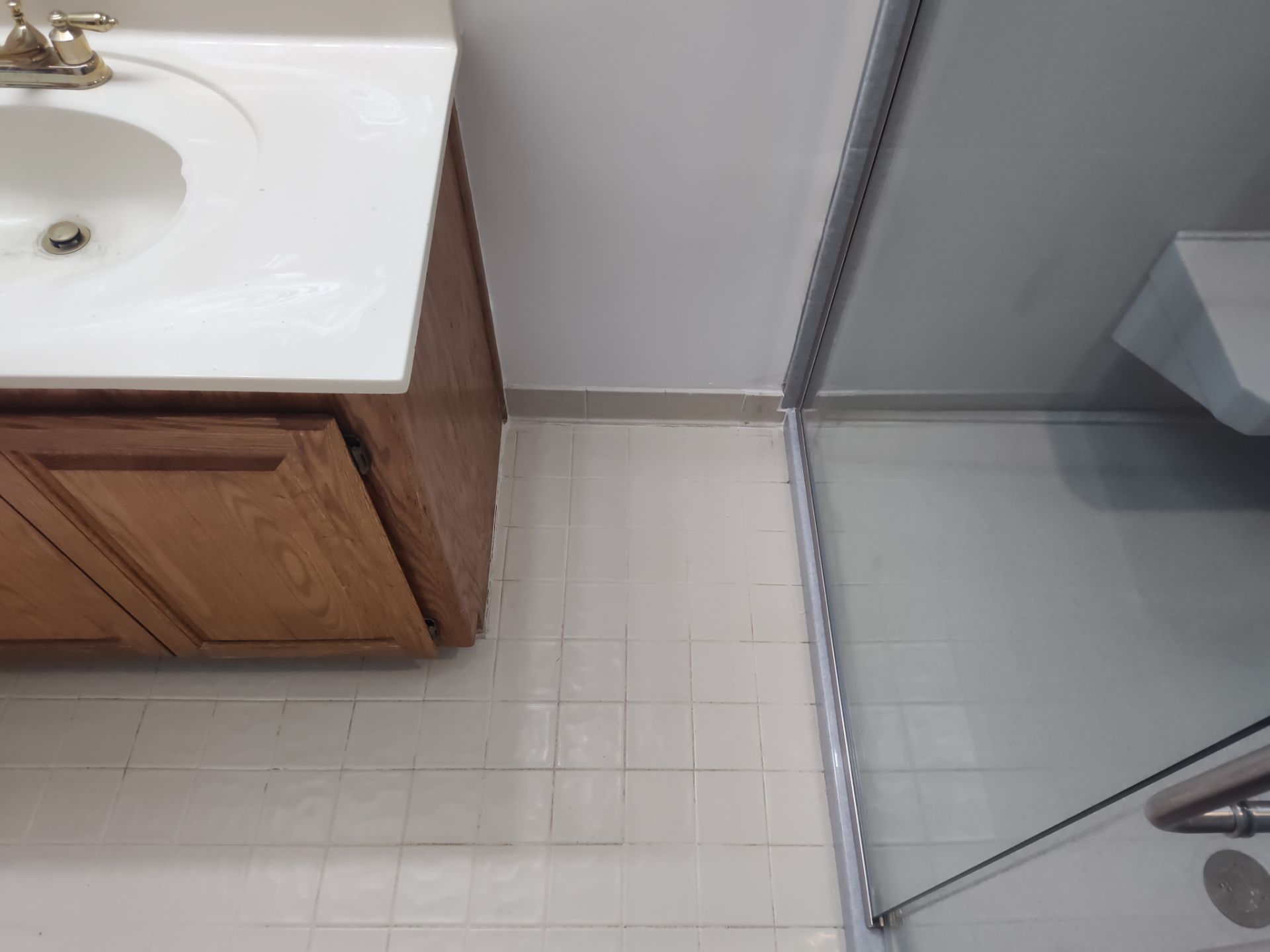 Bathroom Remodel using Onyx base and shower walls with seat & caddie by Cornerstone Home Builders, LLC