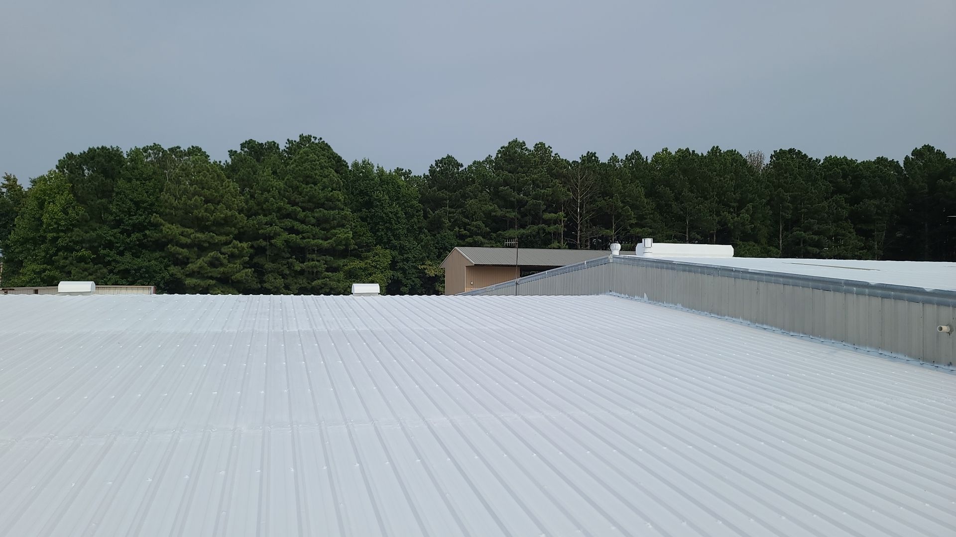 Commercial Roofing Installation using Aldocoat Coatings by Hostetler Roofing