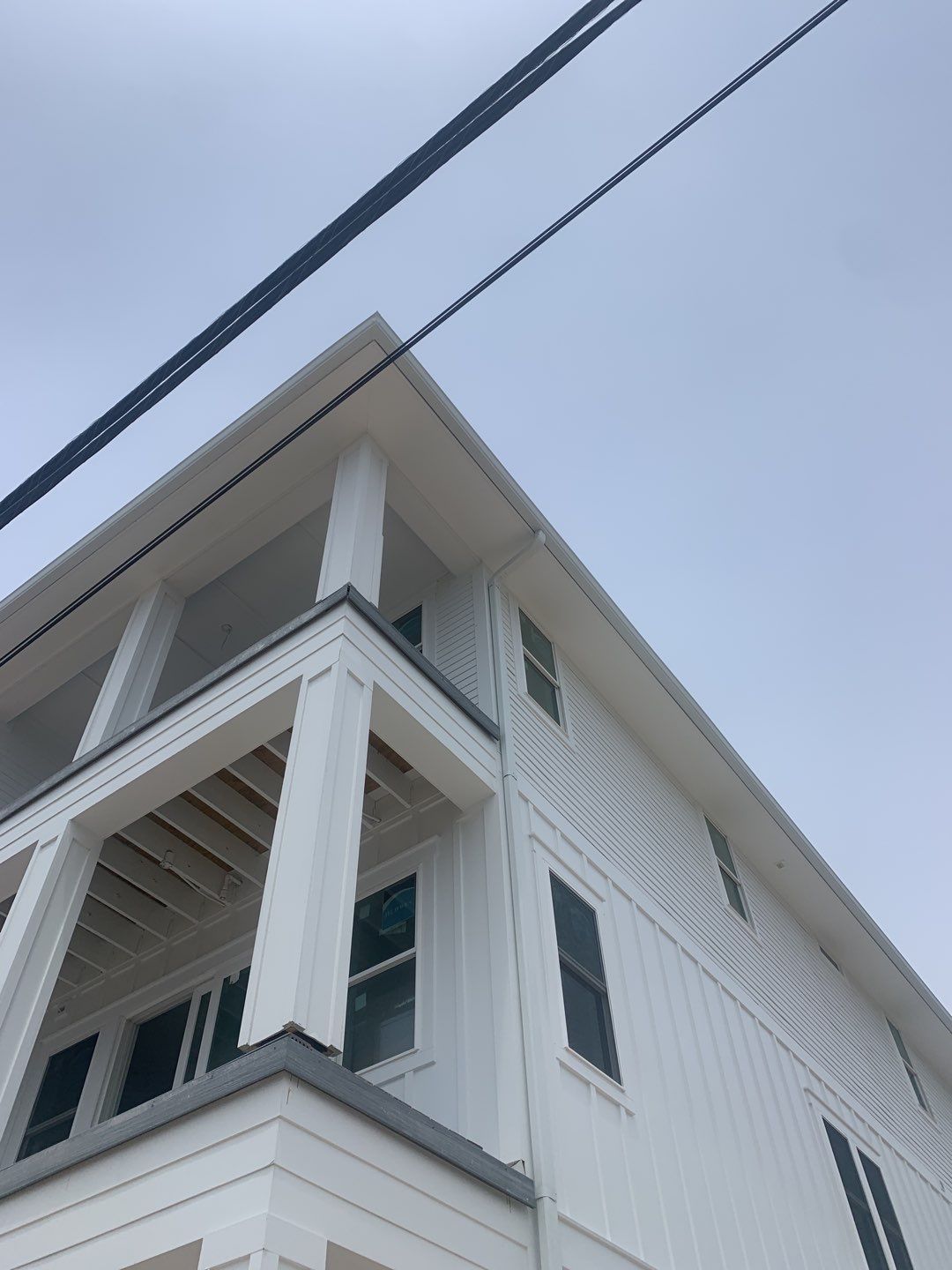 Downspout Installation for Multi-Story Building in Panama City FL by Gutter Professors