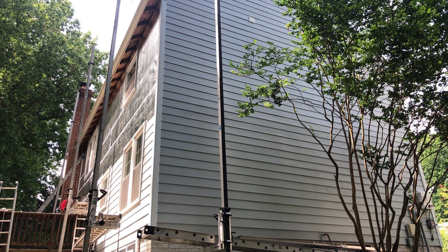 Exterior Home Makeover using GAF Timberline HDZ, GAF Decotech, and James Hardie Siding by American Home Contractors
